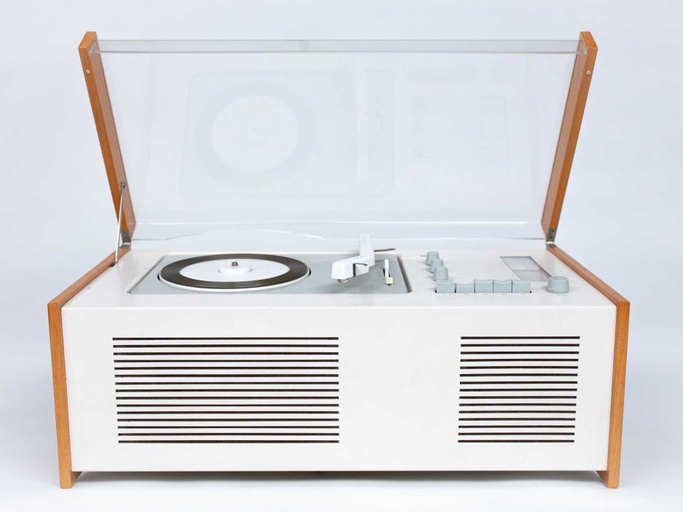 A white record player with a glass lid, allowing you to see the operation of the machine.