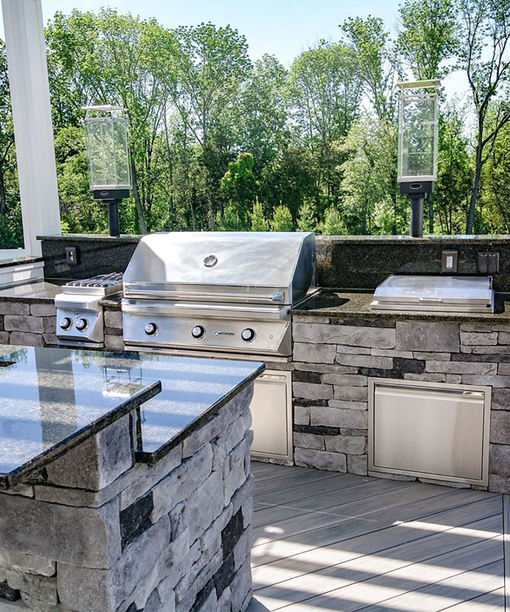 Northfield custom backyard kitchen with pavilion and grill and outdoor refrigerator