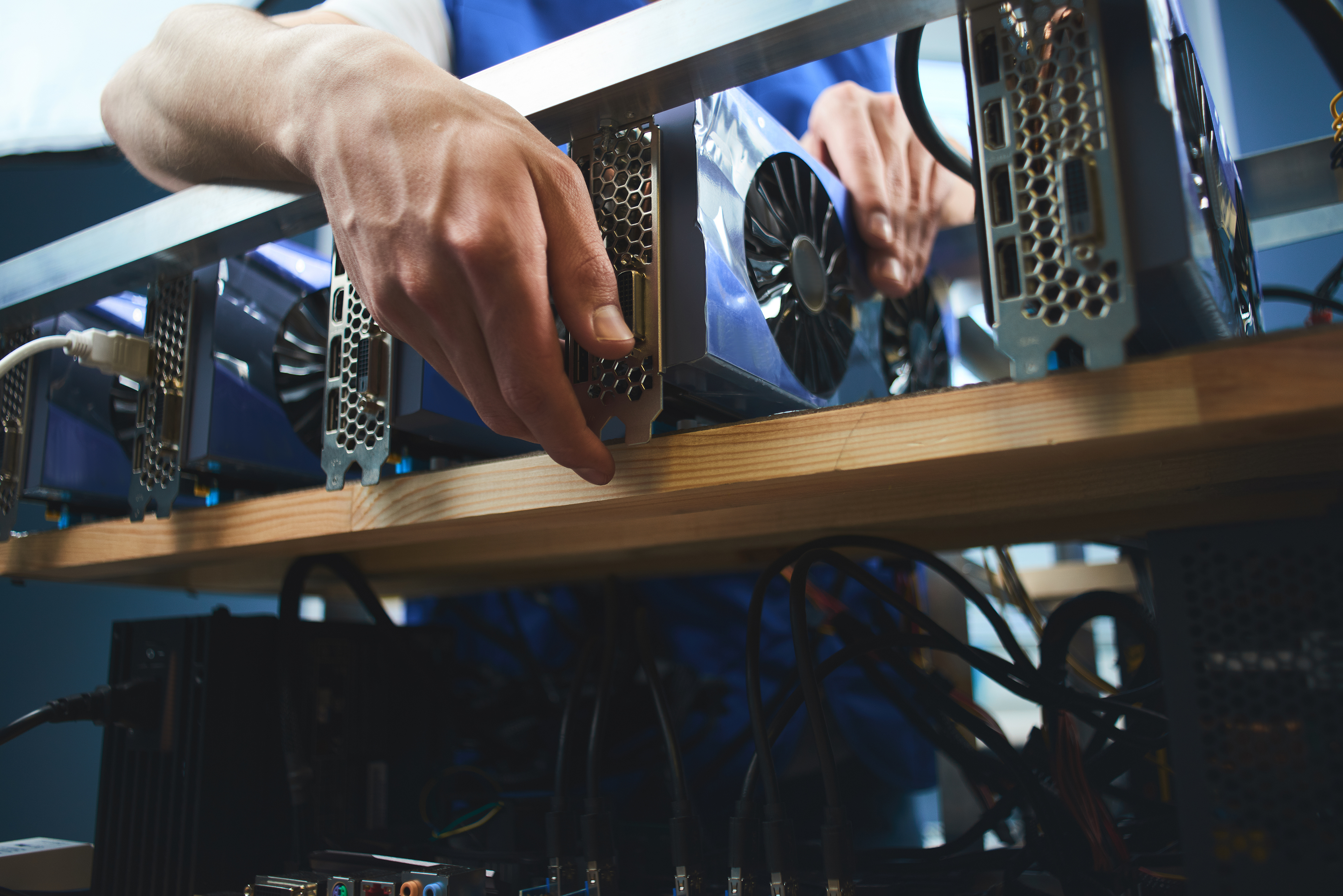 young-man-sets-up-farm-extraction-cryptocurrency.jpg