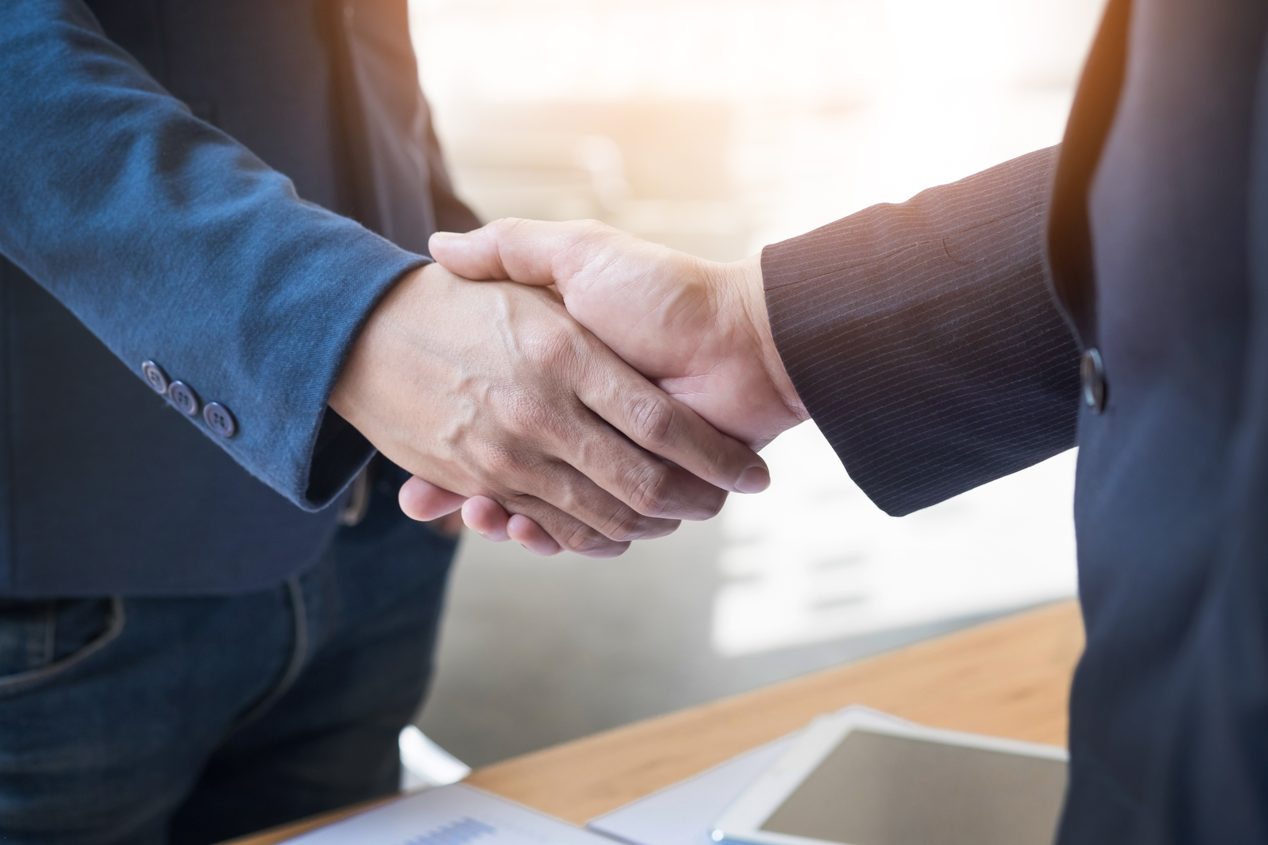 two-confident-business-man-shaking-hands-meeting-office-success-dealing-greeting-partner-concept.jpg