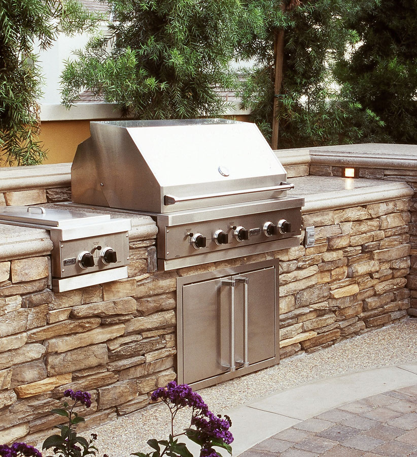 Stone veneer Columbia Station Ohio outdoor kitchen with built in grill