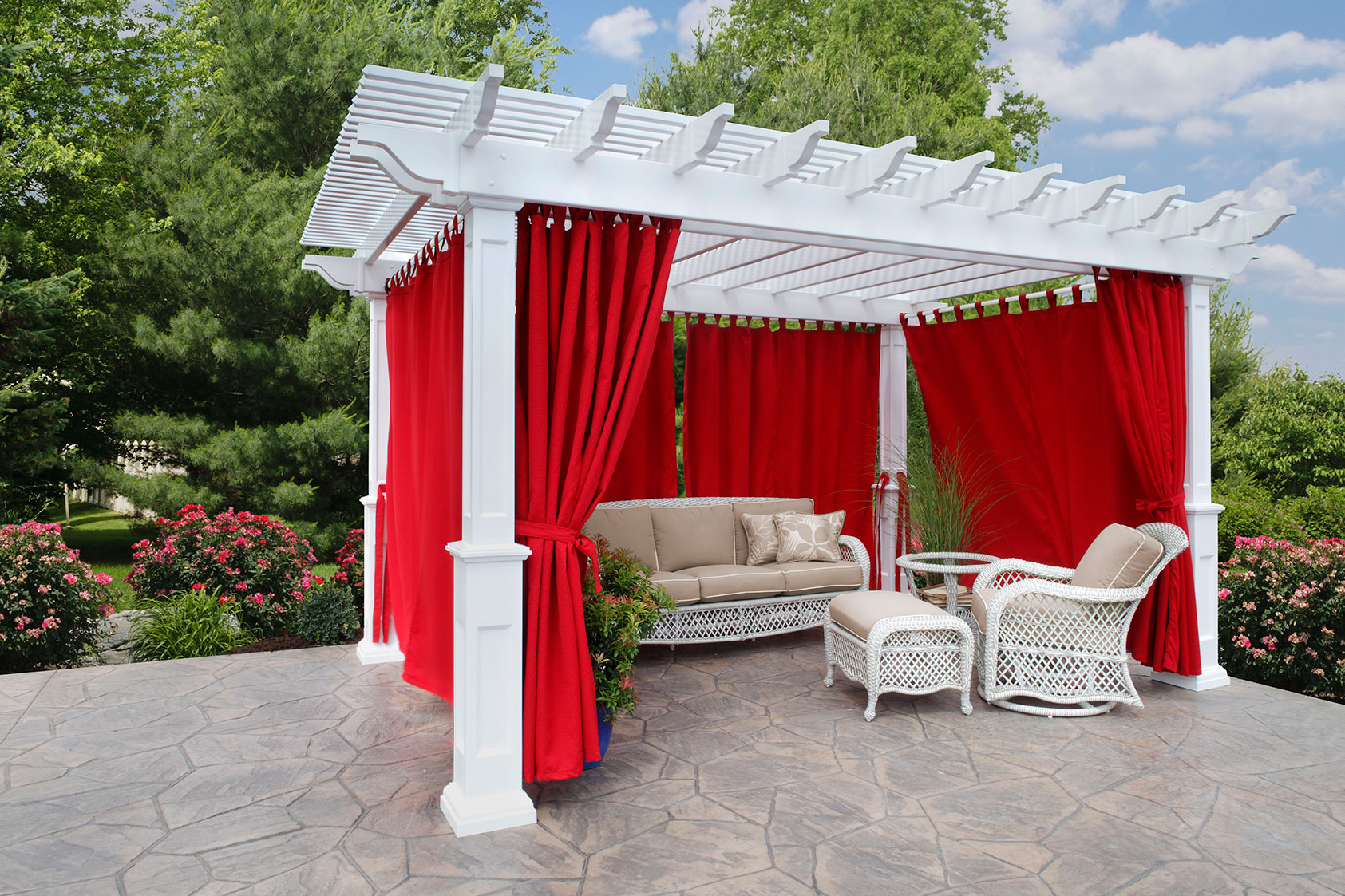 Dusk in a Cleveland Ohio backyard with vinyl pergola, curtains and outdoor poly furniture