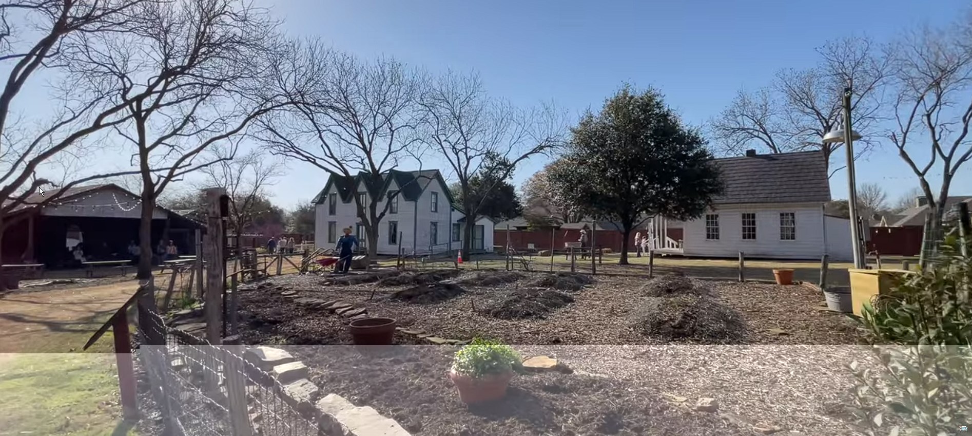 Garden and other buildings in Plano, TX at the Heritage Farmstead Museum