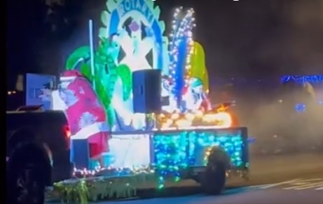 A parade float decorated with Christmas lights at the Waimea Light Parade Christmas parade in Waimea, Kauai, Hawaii