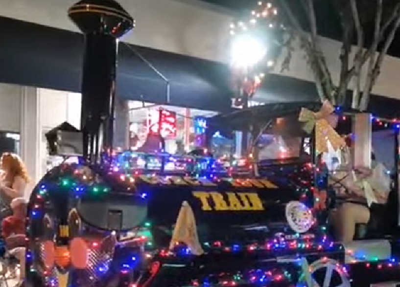 Train float with Christmas lights at the Key West Hometown Holiday Christmas Parade in Key West, Florida