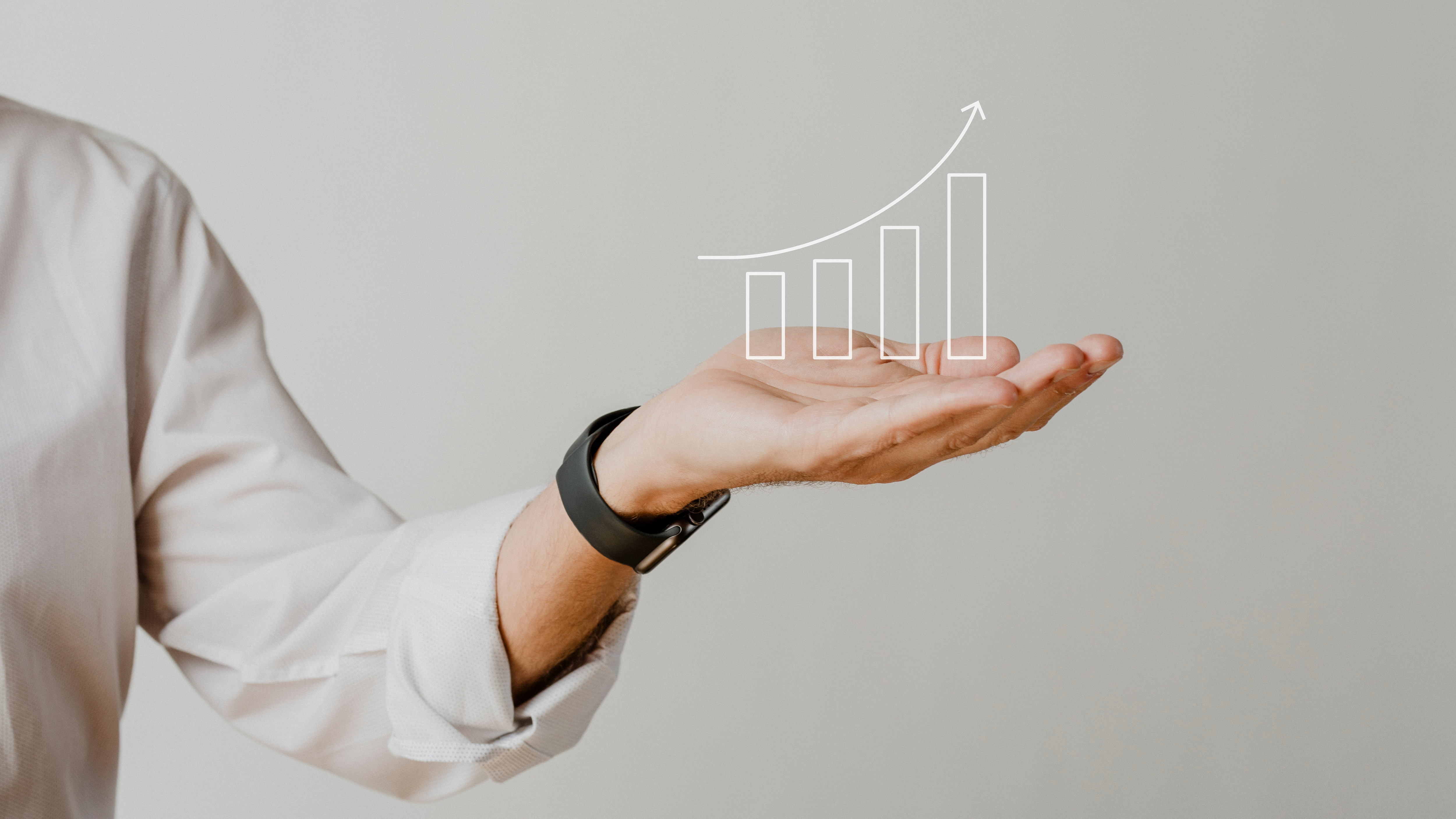 digital-increasing-bar-graph-with-businessman-hand-overlay (1).jpg