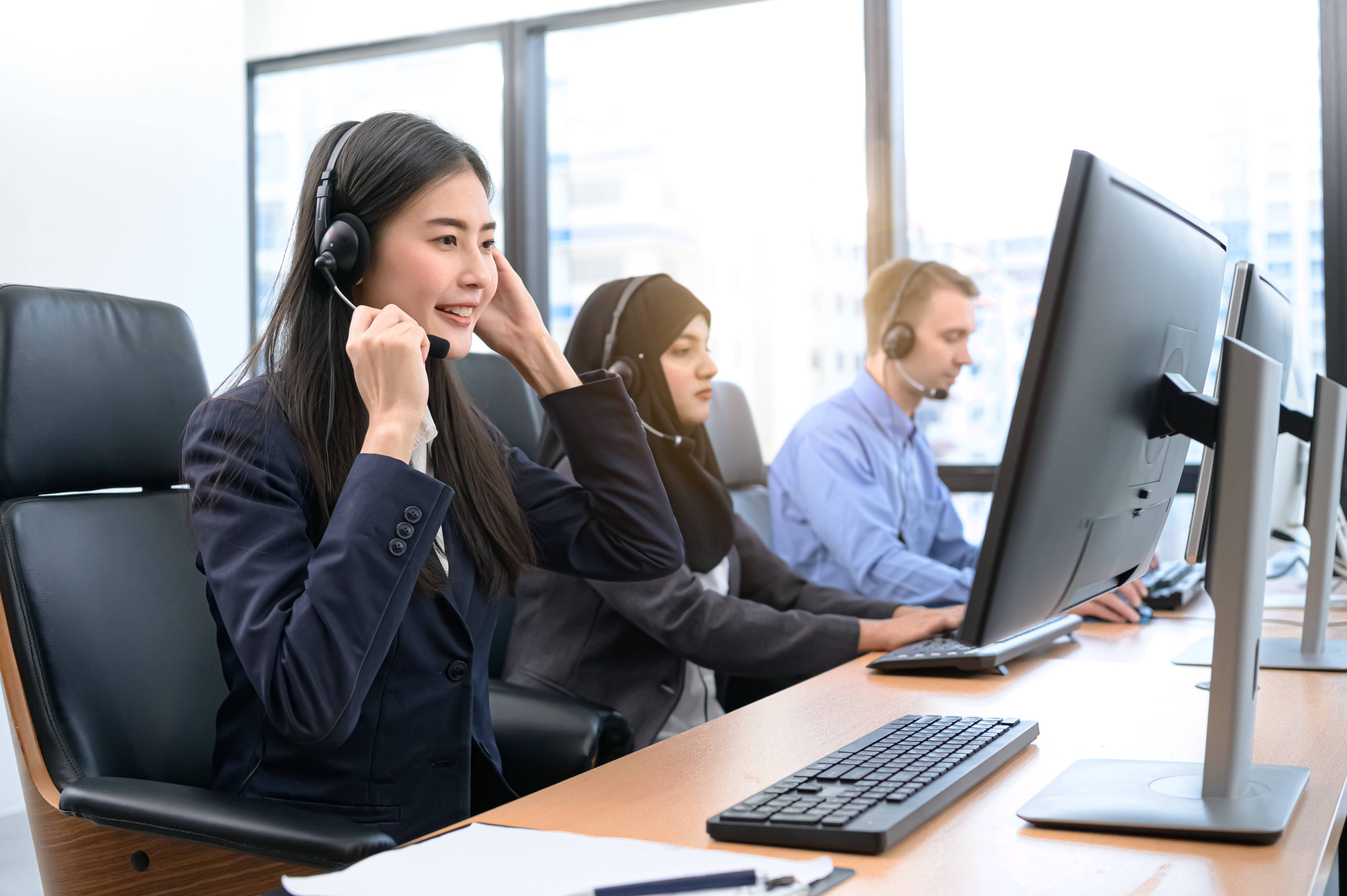 customer-service-representatives-working-table-office.jpg