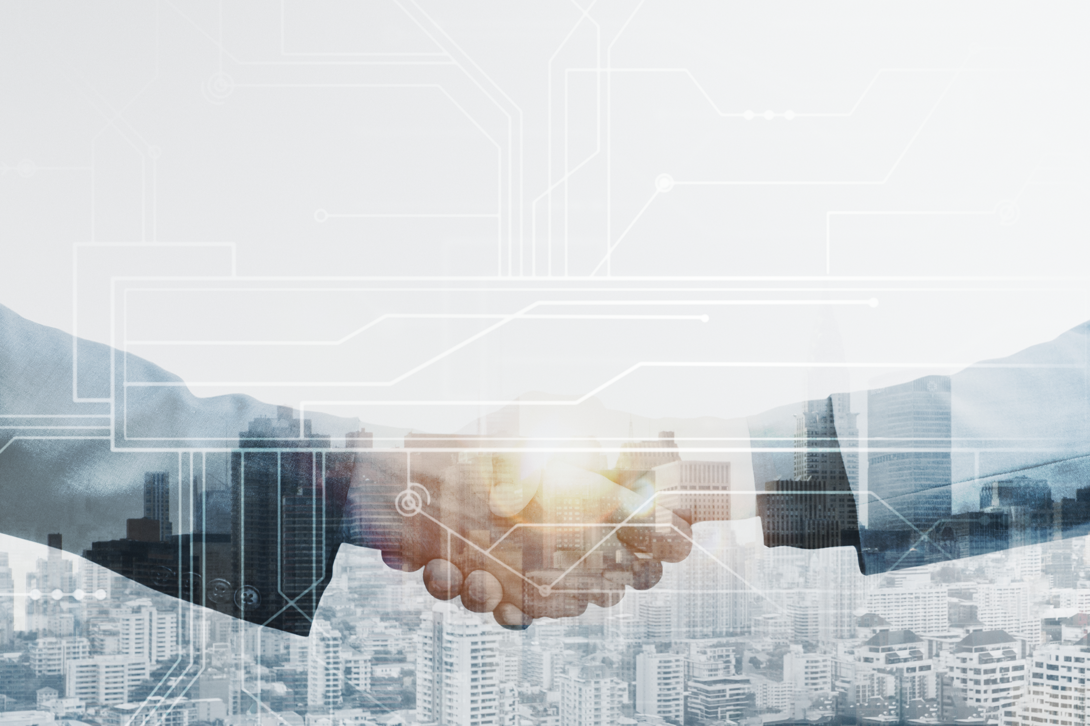 business-partners-handshake-global-corporate-with-technology-concept (1).jpg