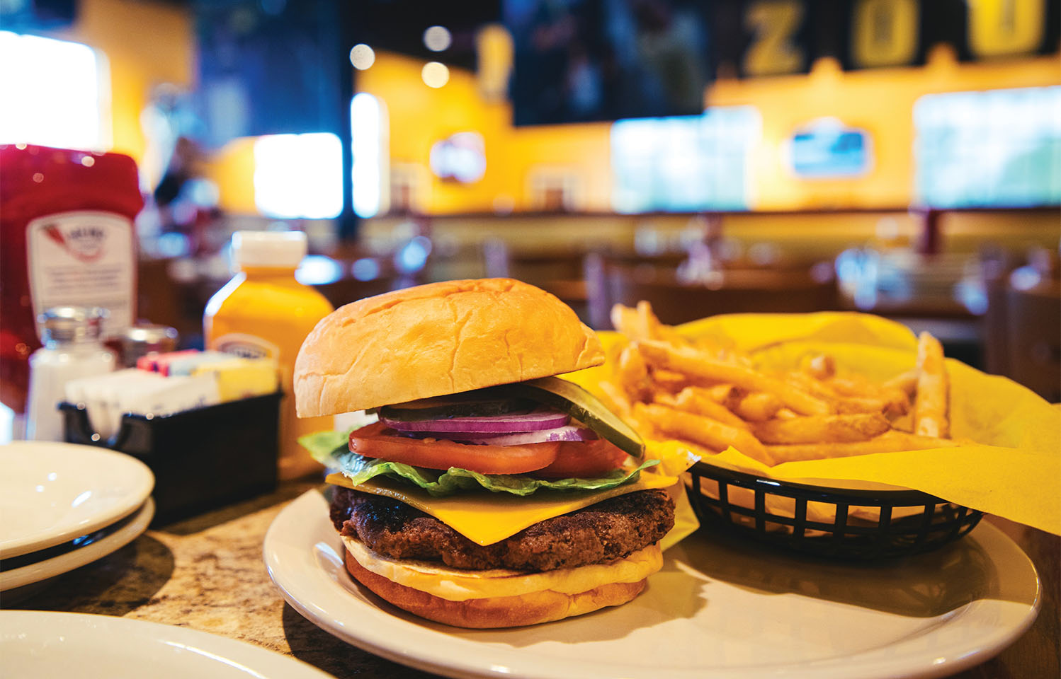 Sit outside on the patio at Stadium Grill with friends after work in Columbia, MO.