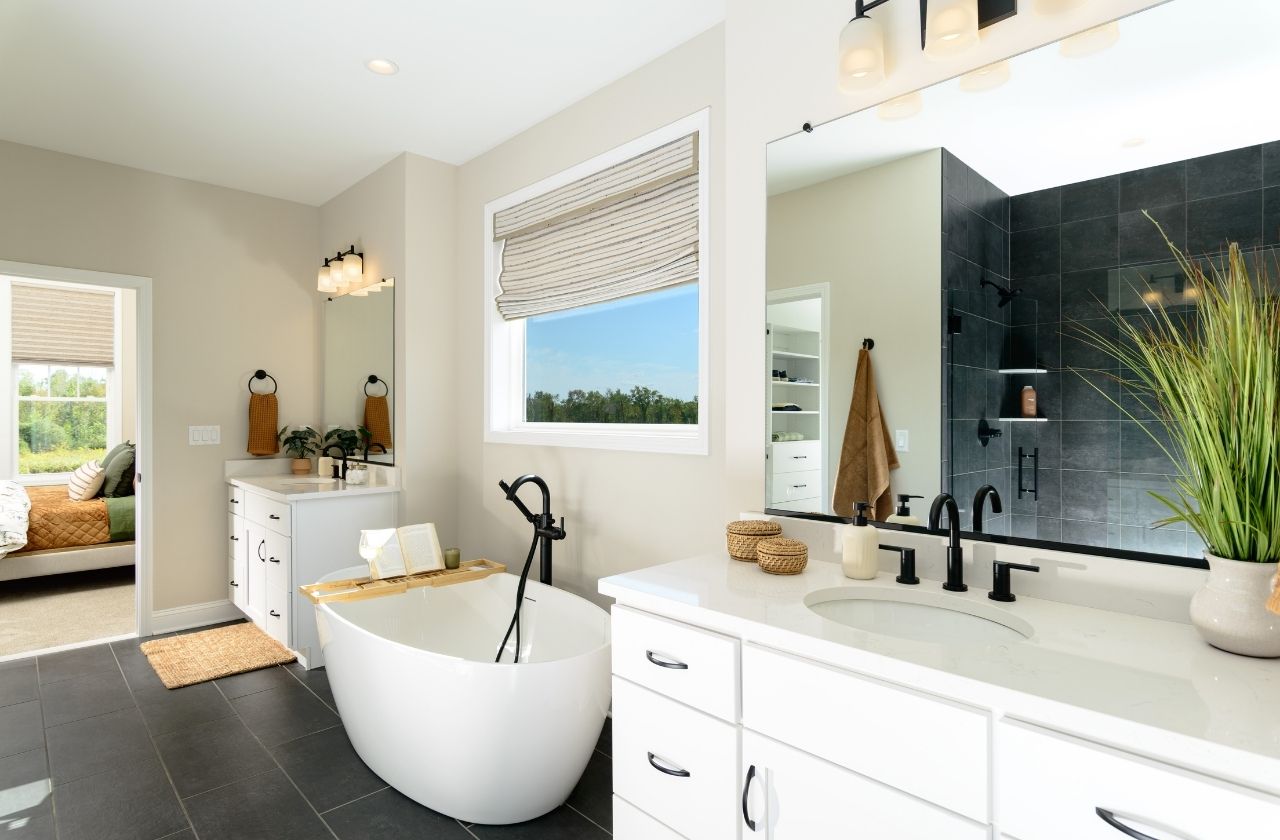 18 Dahlia Drive - Lincoln Ranch - Primary Bathroom featuring a free standing soaking tub