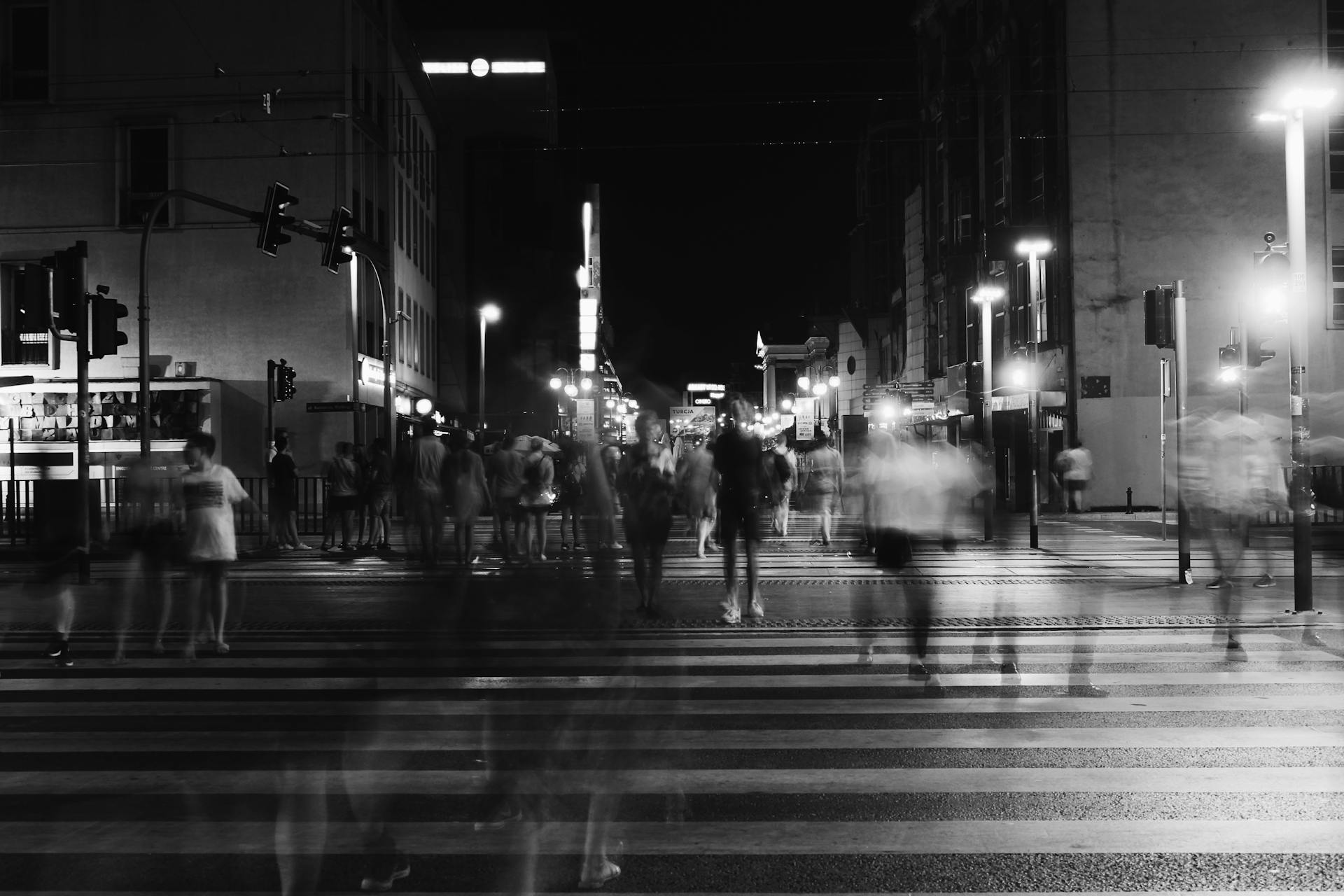 Group of People Crossing Pedestrian Lane