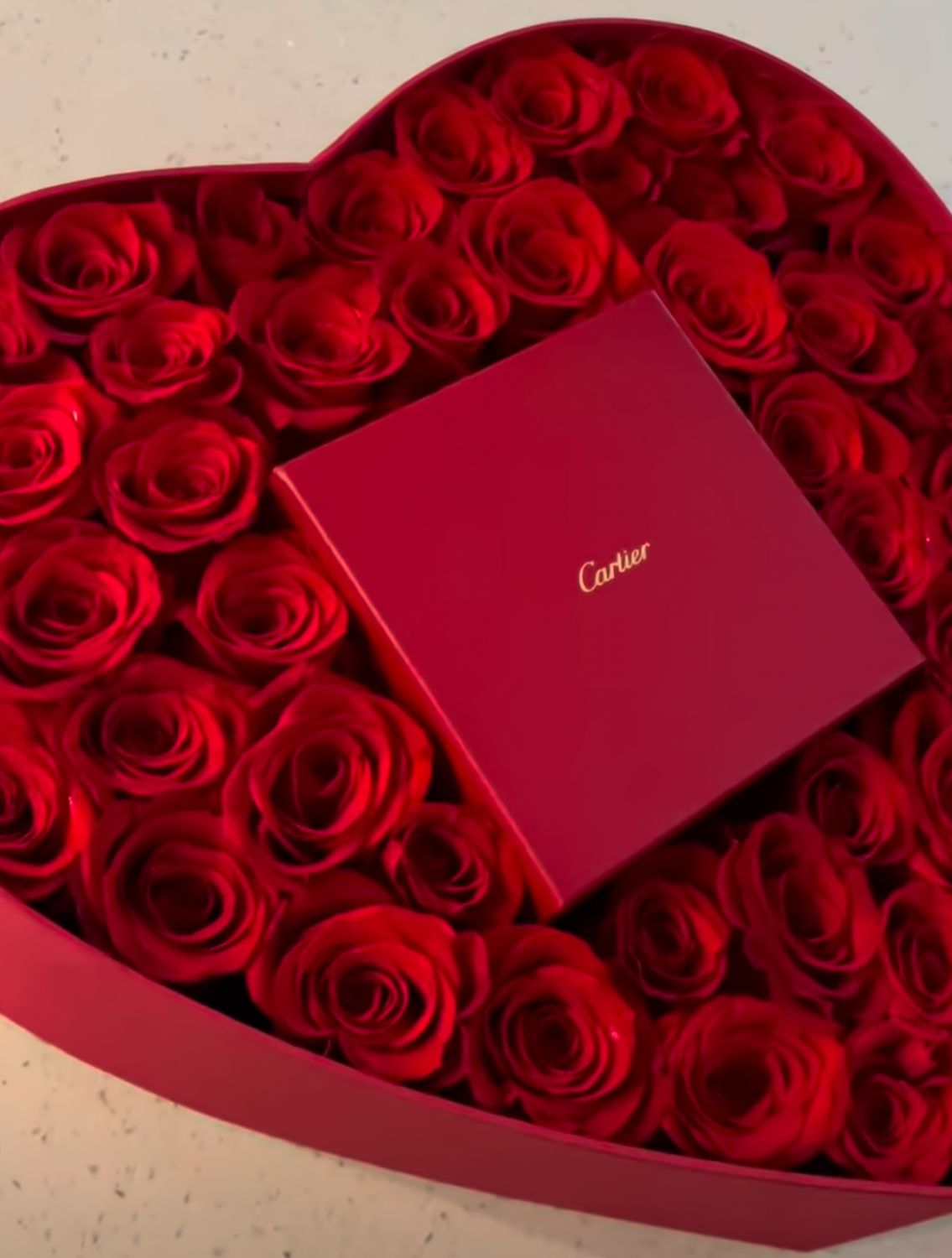 cartier box and red roses