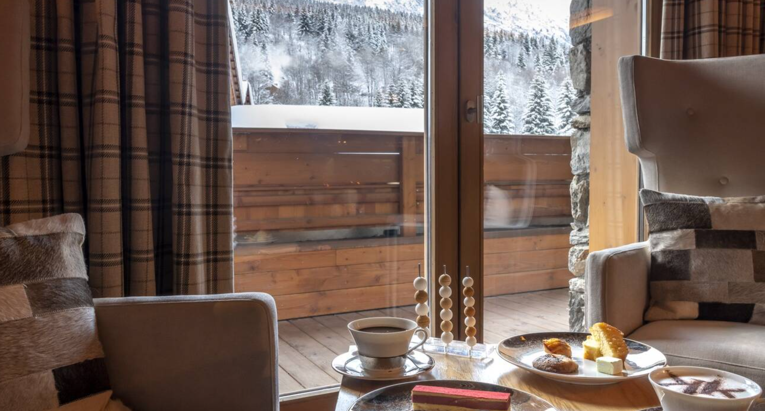 Le Kaïla - Luxury ski hotel gallery image 9 showing alpine architecture, interior design, or mountain views