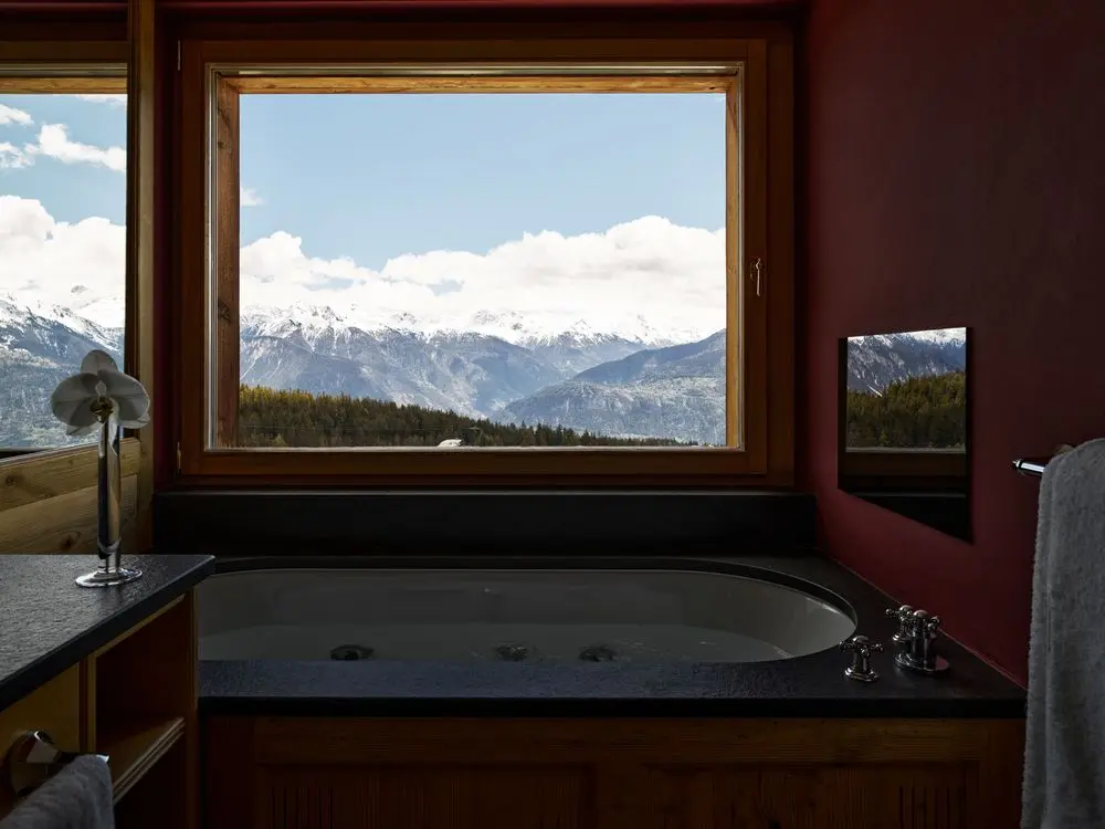 LeCrans Hotel & Spa - Luxury ski hotel gallery image 10 showing alpine architecture, interior design, or mountain views