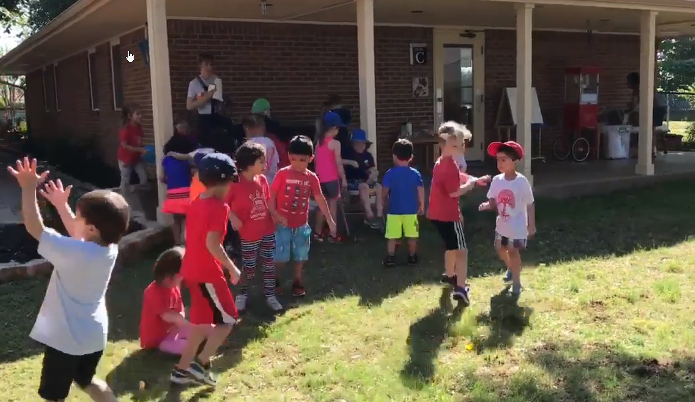 Children playing in the back yard of Waypoint Montessori in Colleyville, TX