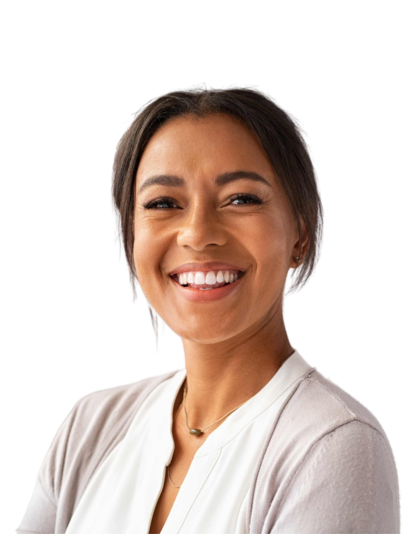 A woman in a white shirt is smiling with her hand on her chin