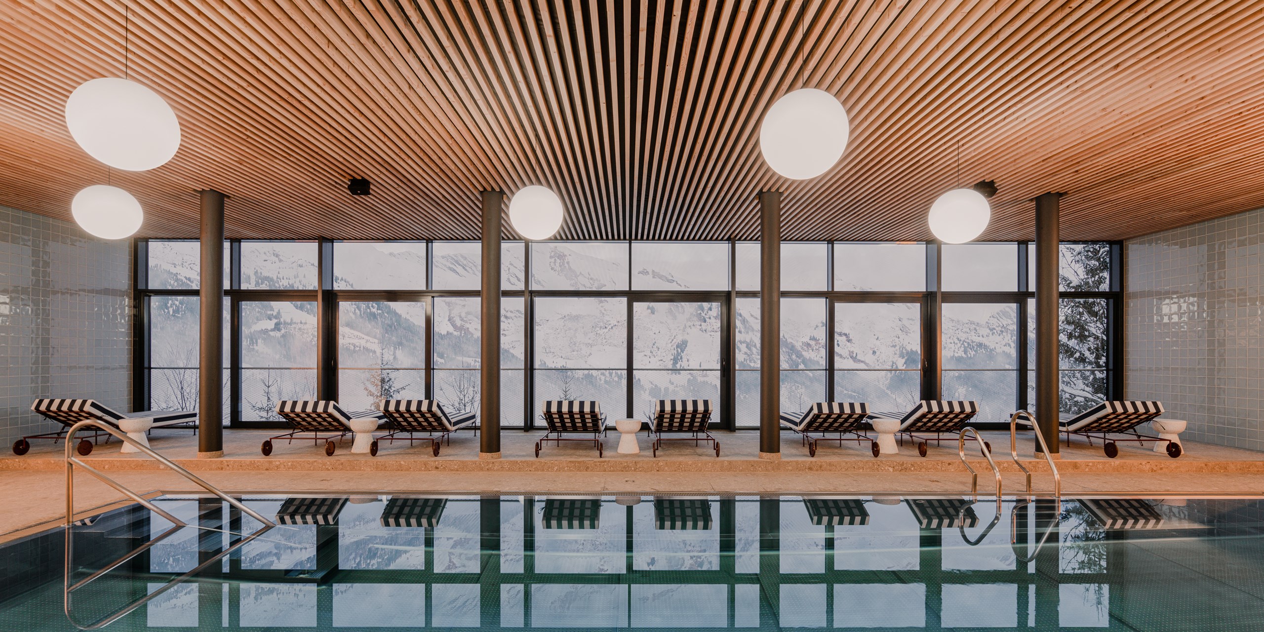 the cōmodo - Luxury ski hotel gallery image 2 showing alpine architecture, interior design, or mountain views