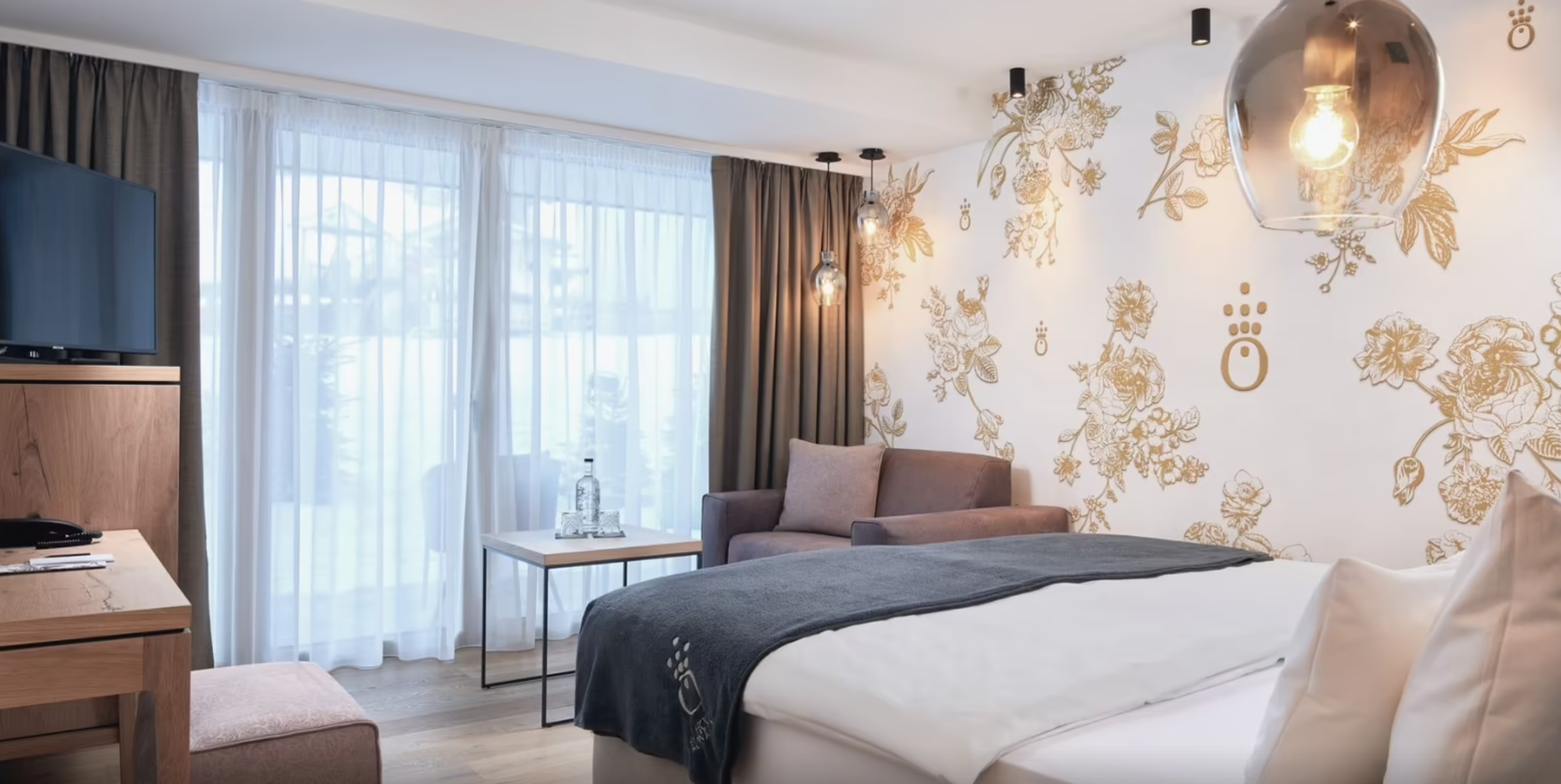 die HOCHKÖNIGIN Mountain Resort - Luxury ski hotel gallery image 7 showing alpine architecture, interior design, or mountain views