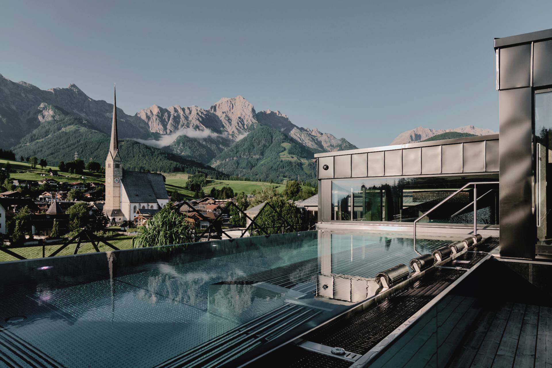 die HOCHKÖNIGIN Mountain Resort - Luxury ski hotel gallery image 17 showing alpine architecture, interior design, or mountain views