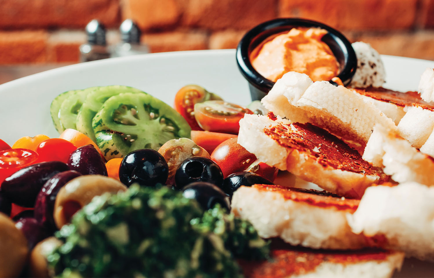 Bring your family and friends to Teller's Gallery & Bar for an incredible dining experience in Columbia, MO.