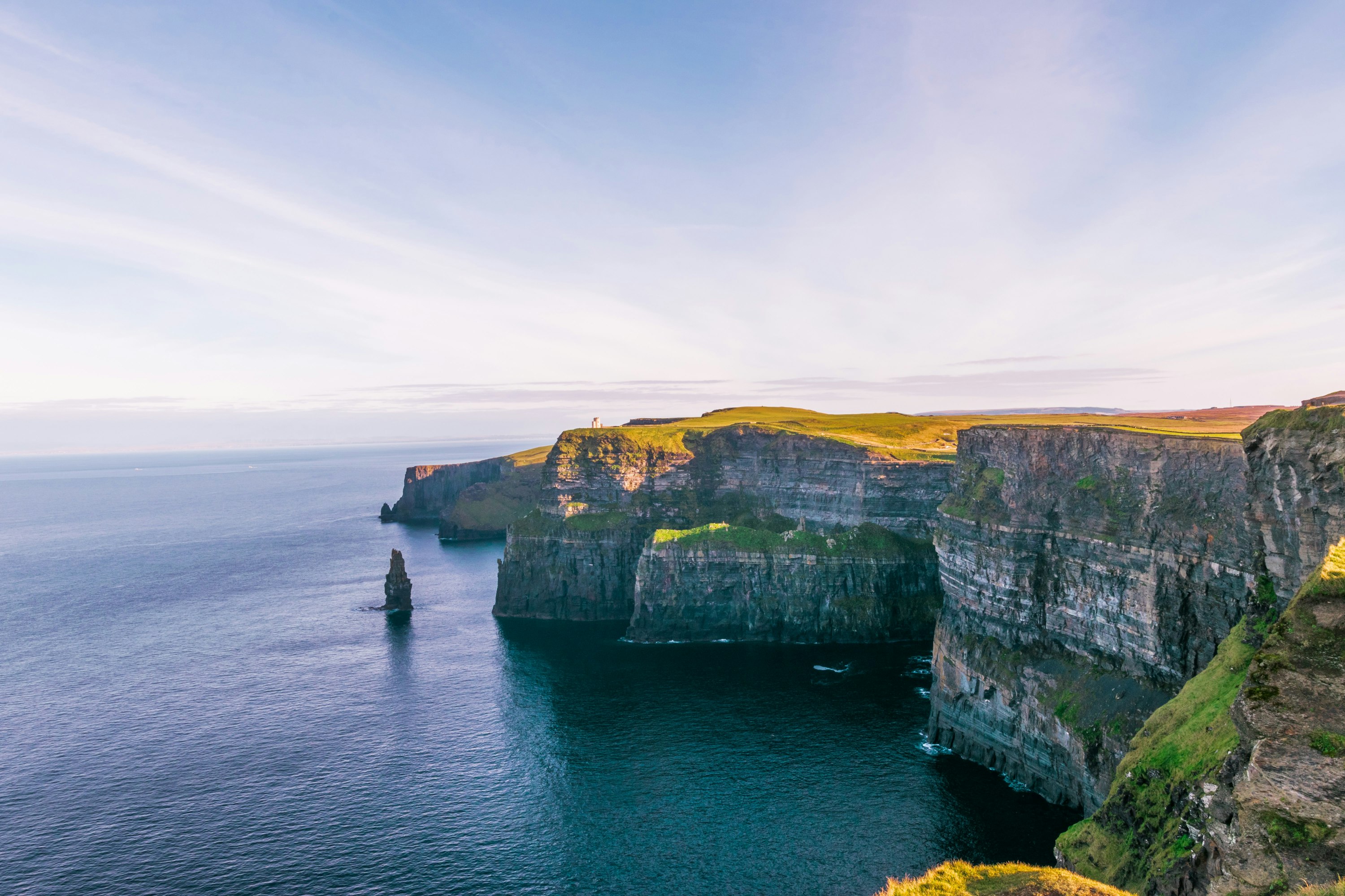 Cliffs of Moher in Ireland overlooking the Atlantic Ocean at sunset