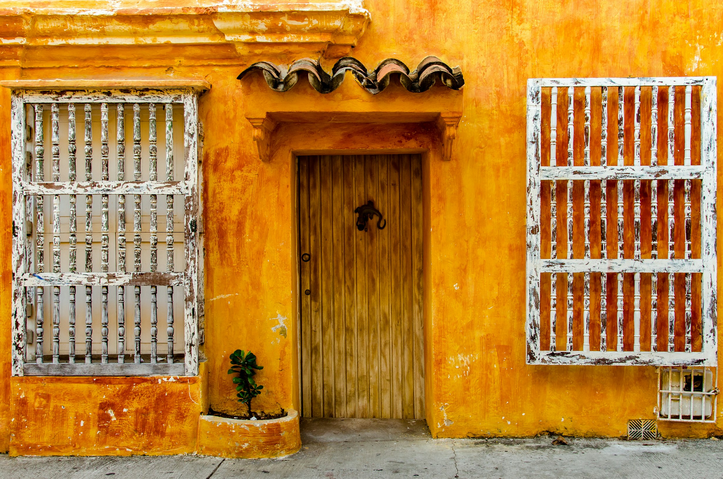 Bright yellow colonial doorway in Cartagena, Colombia