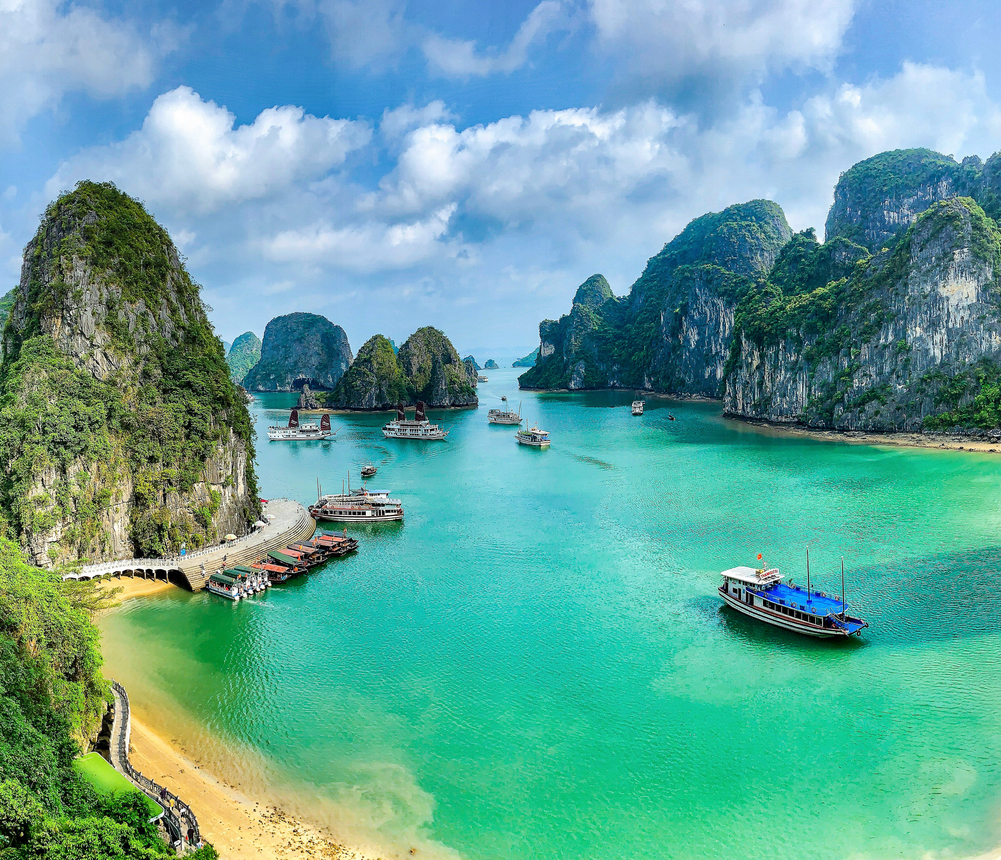 Aerial view of Vietnam's limestone island cliffs and blue waters