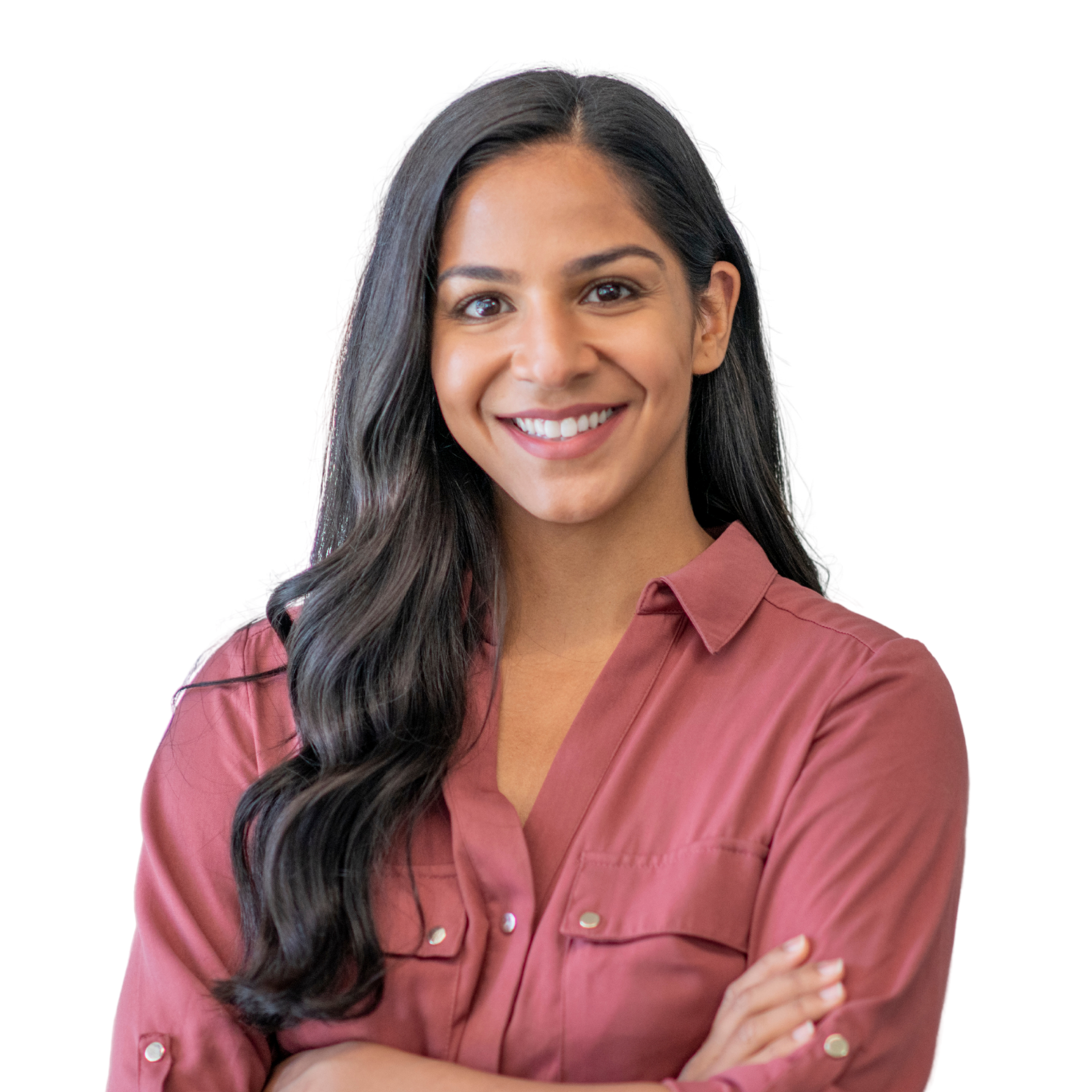 A woman with long hair is smiling with her hands on her face.