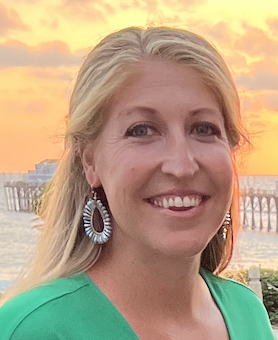 A woman is examining a man 's head in a lab