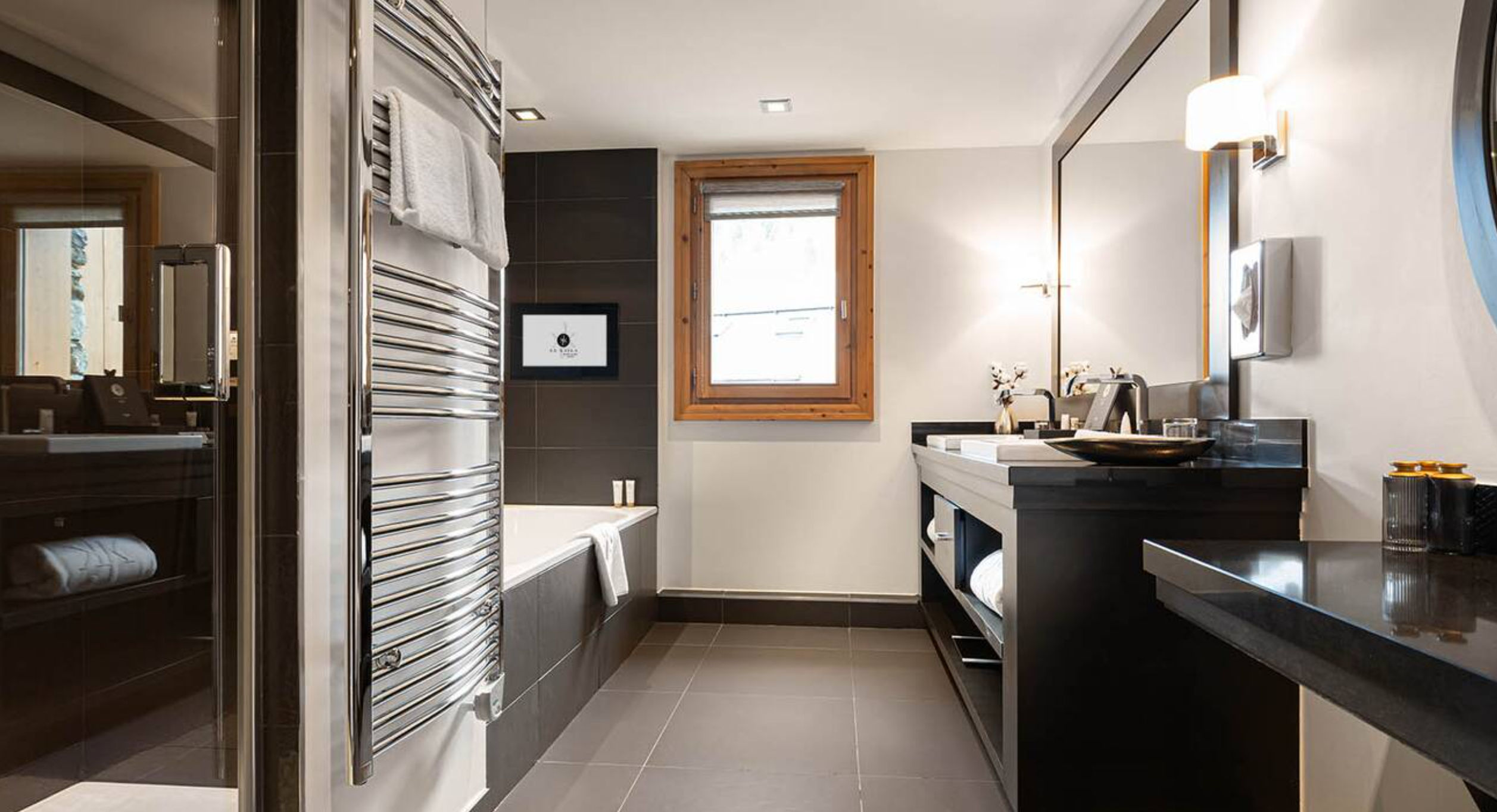 Le Kaïla - Luxury ski hotel gallery image 14 showing alpine architecture, interior design, or mountain views