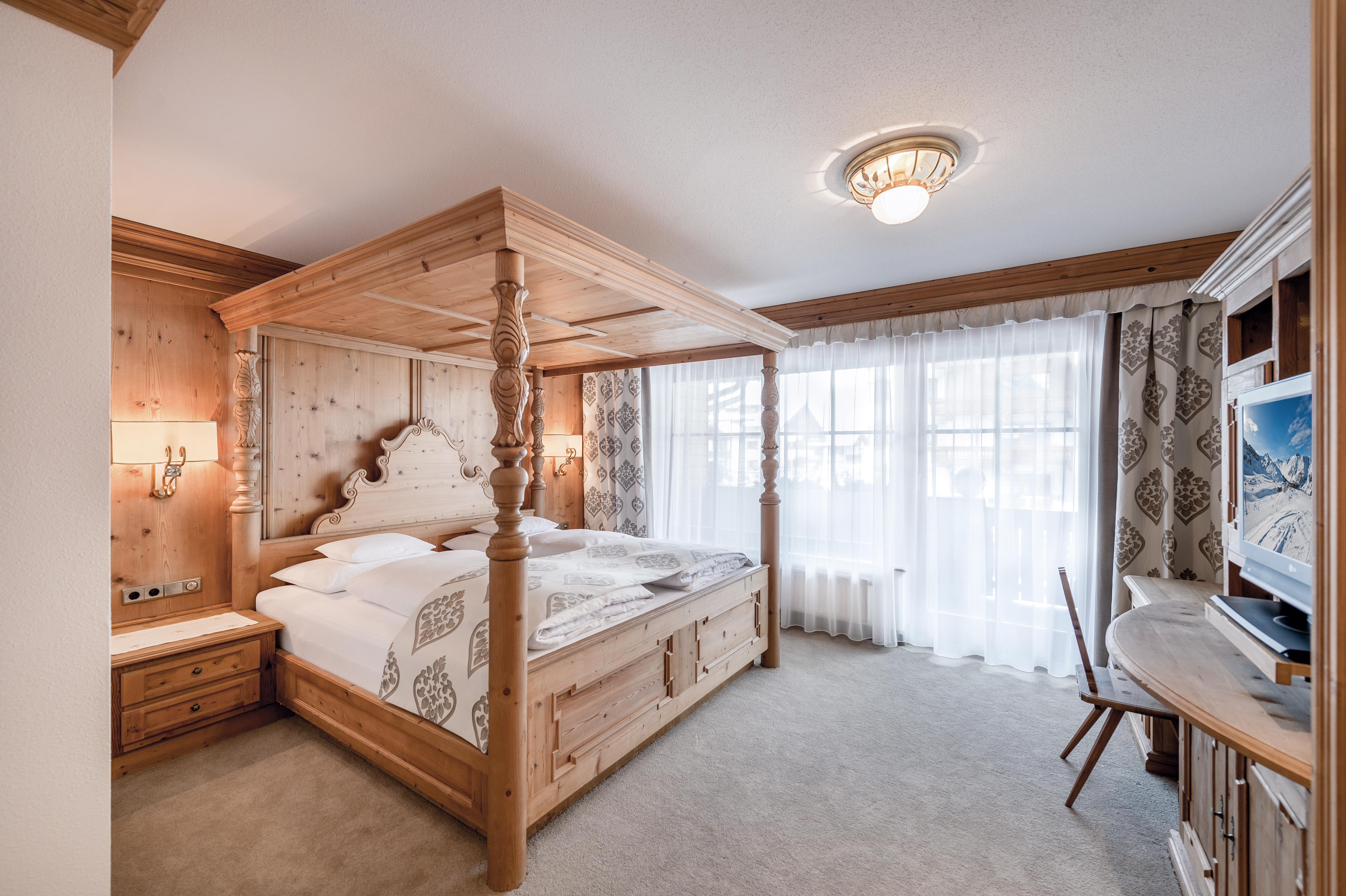 Hotel Trofana Royal Resort - Luxury ski hotel gallery image 13 showing alpine architecture, interior design, or mountain views