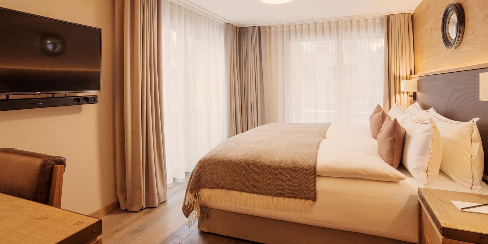 The Capra Hotel - Luxury ski hotel gallery image 8 showing alpine architecture, interior design, or mountain views