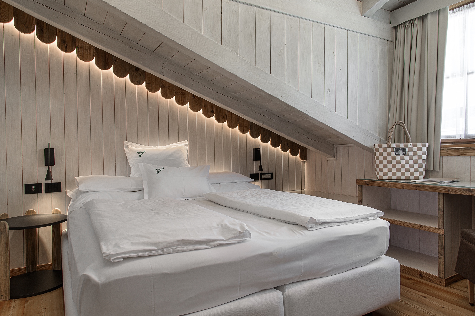 Biohotel Hermitage - Luxury ski hotel gallery image 7 showing alpine architecture, interior design, or mountain views