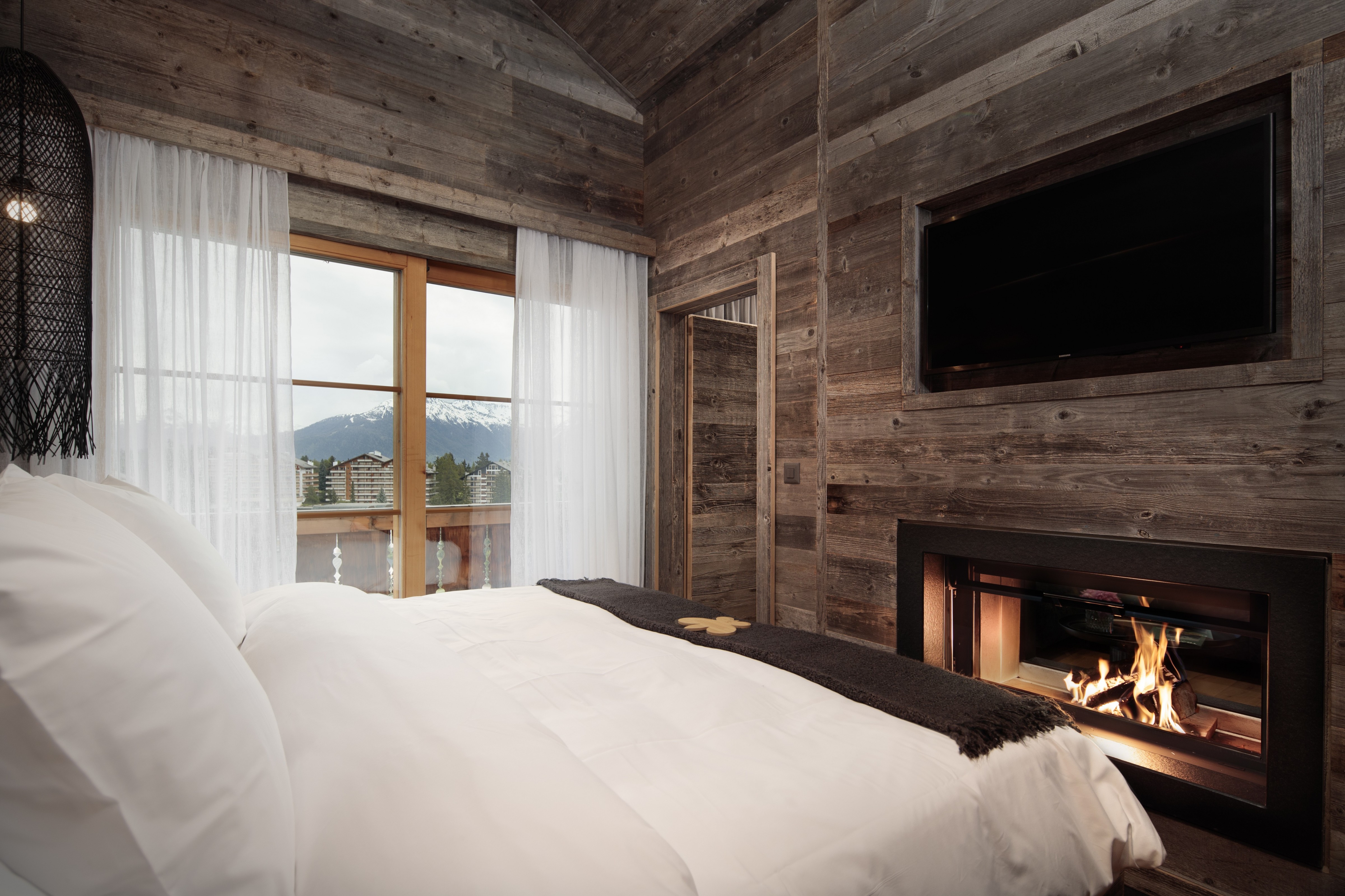 Hostellerie du Pas de l’Ours - Luxury ski hotel gallery image 19 showing alpine architecture, interior design, or mountain views