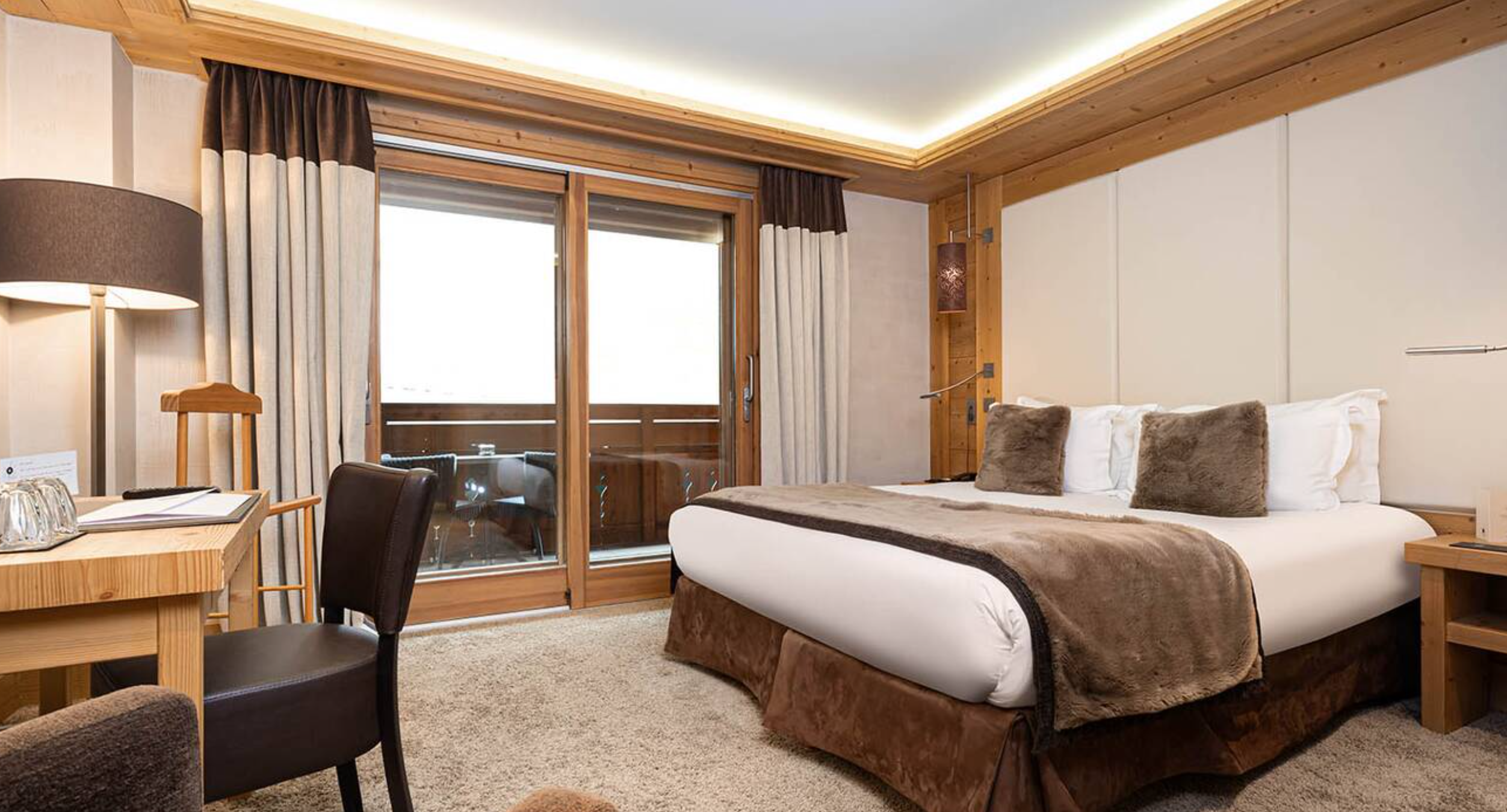 Le Kaïla - Luxury ski hotel gallery image 12 showing alpine architecture, interior design, or mountain views