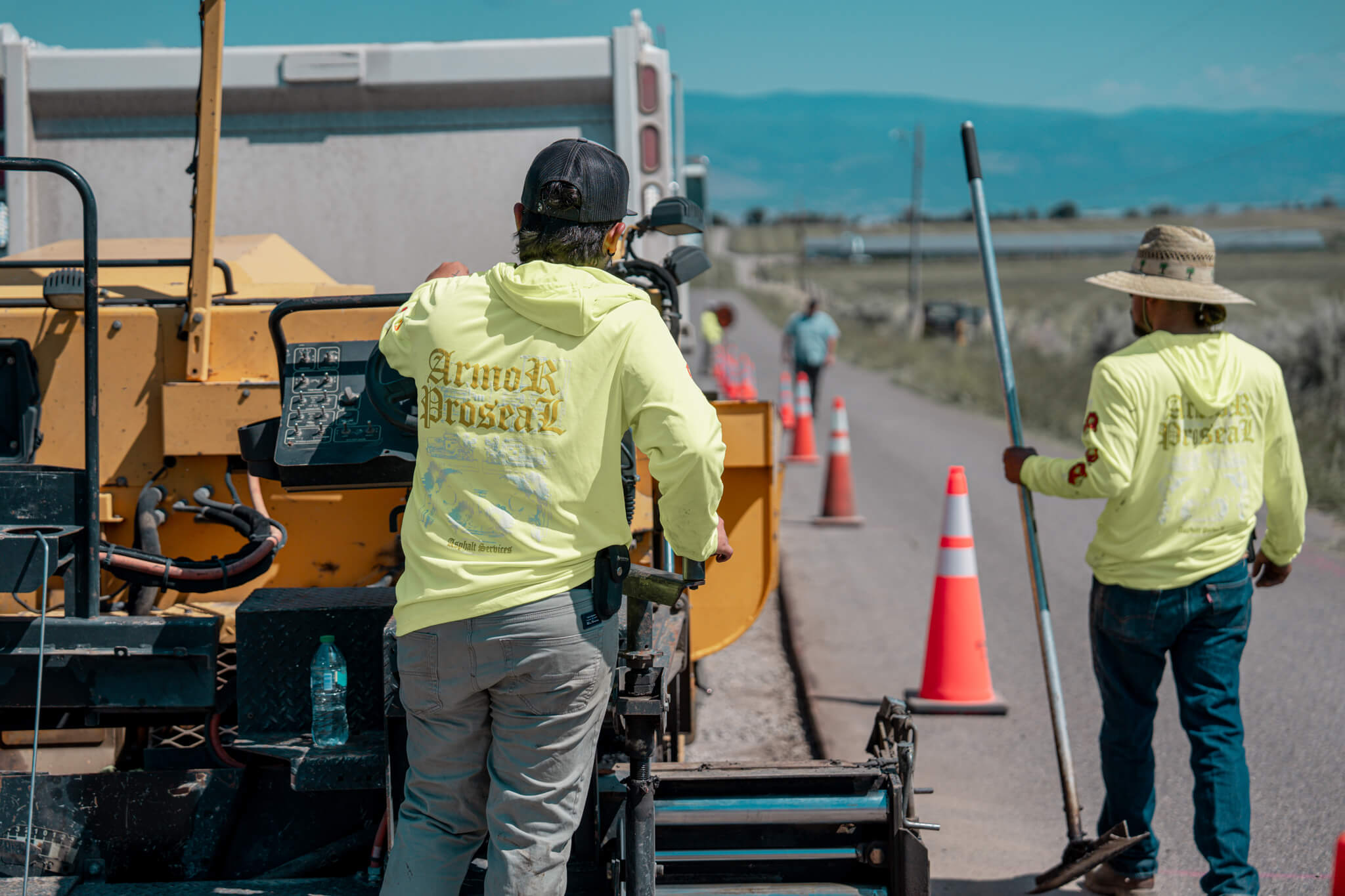 Careful asphalt repair in Dolores, CO historic district, with Armor Proseal technicians preserving community character while improving street infrastructure.