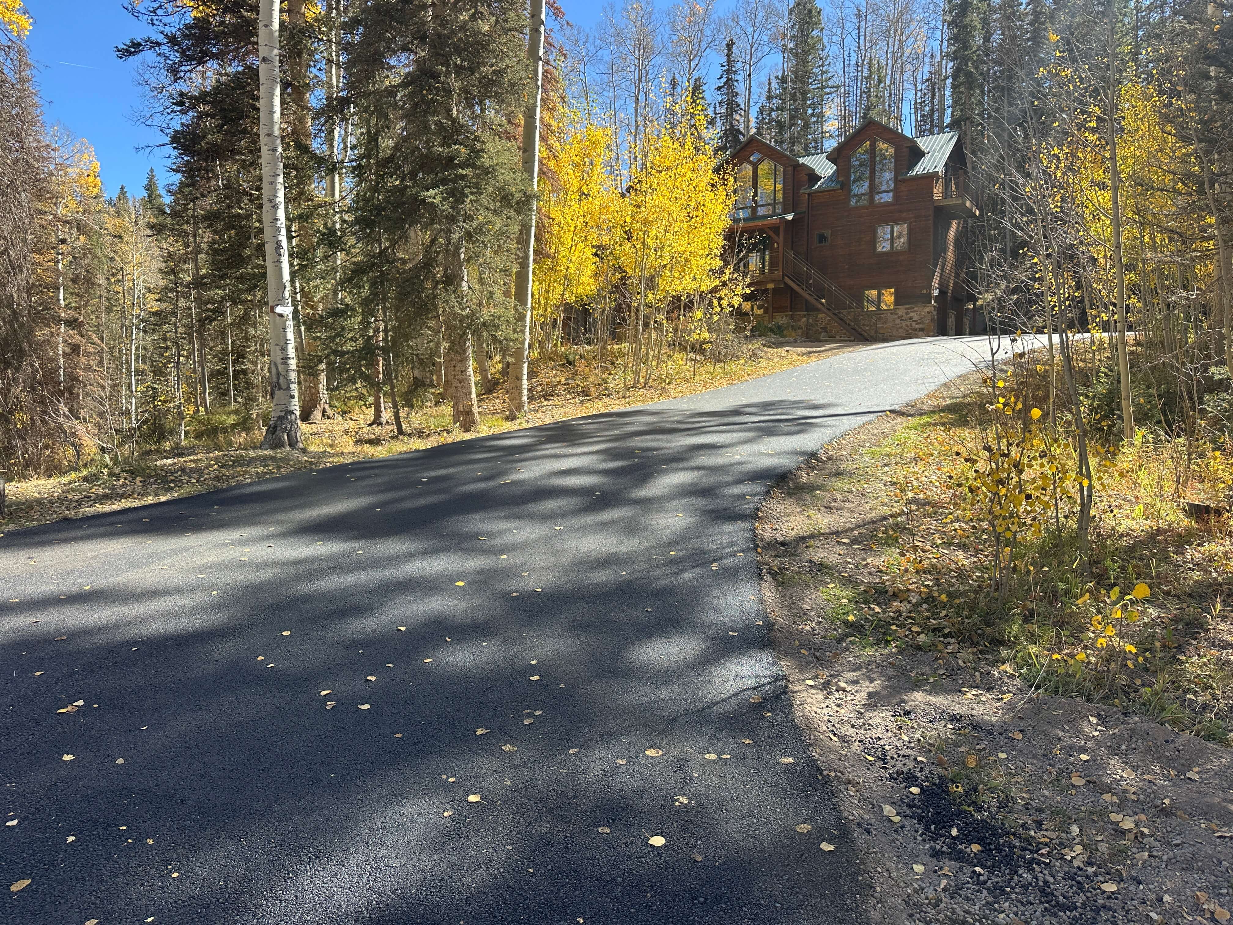 Rural residential driveway installation in Hermosa, CO, showcasing Armor Proseal's ability to enhance mountain properties with professional asphalt surfaces and proper drainage.