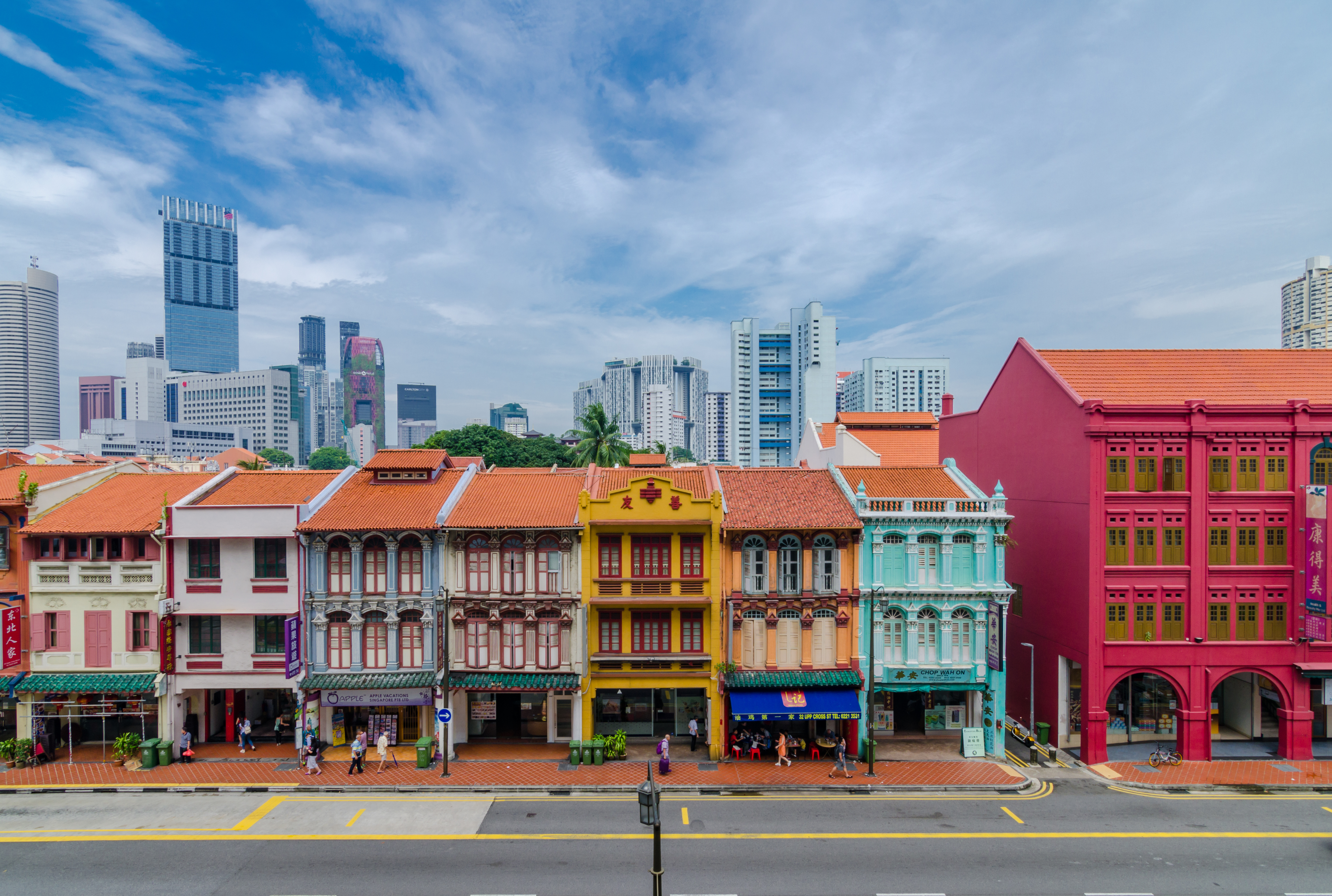 road-by-colorful-buildings-against-sky-city.jpg