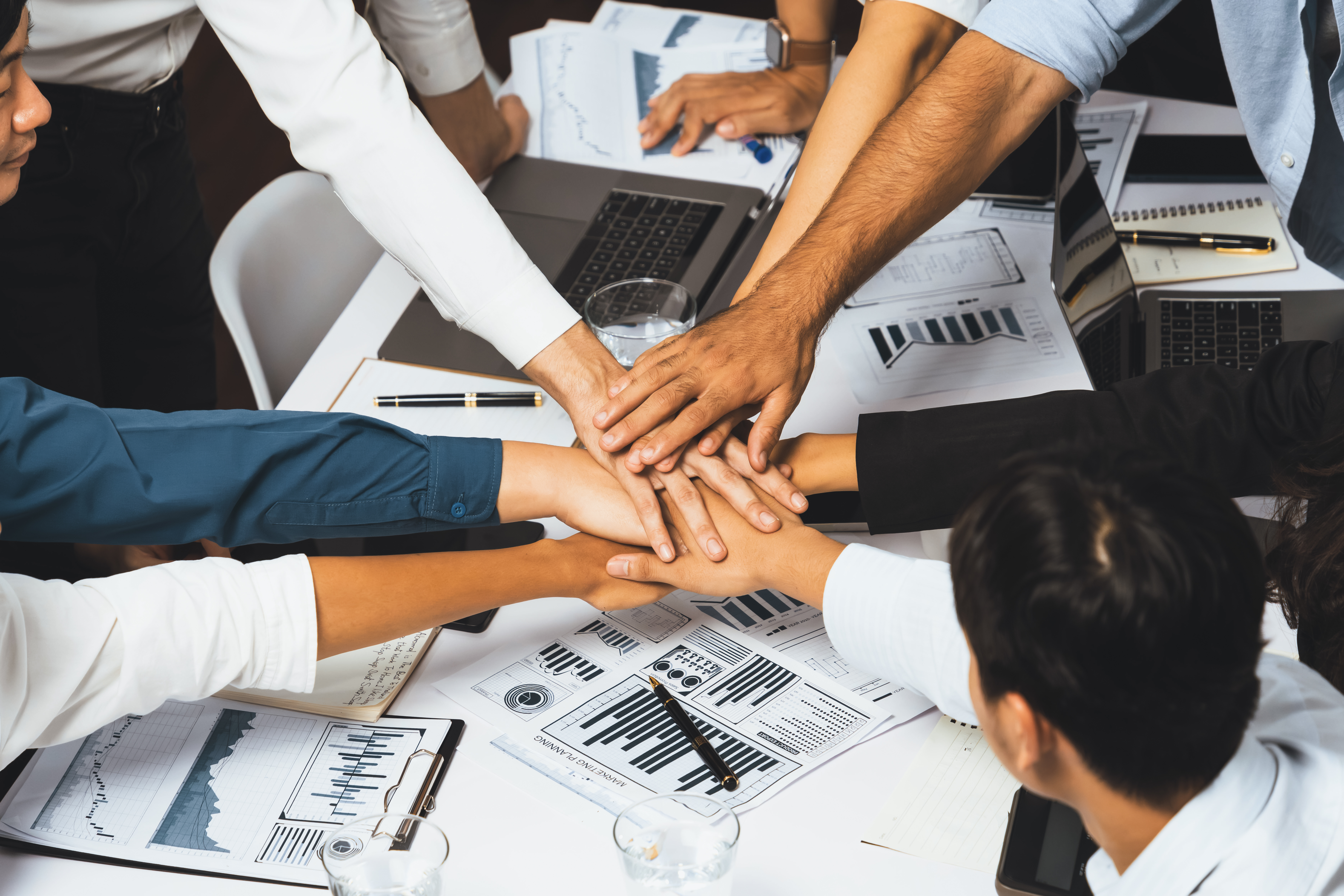 group-diverse-office-worker-employee-high-five-working-together-prudent (1).jpg