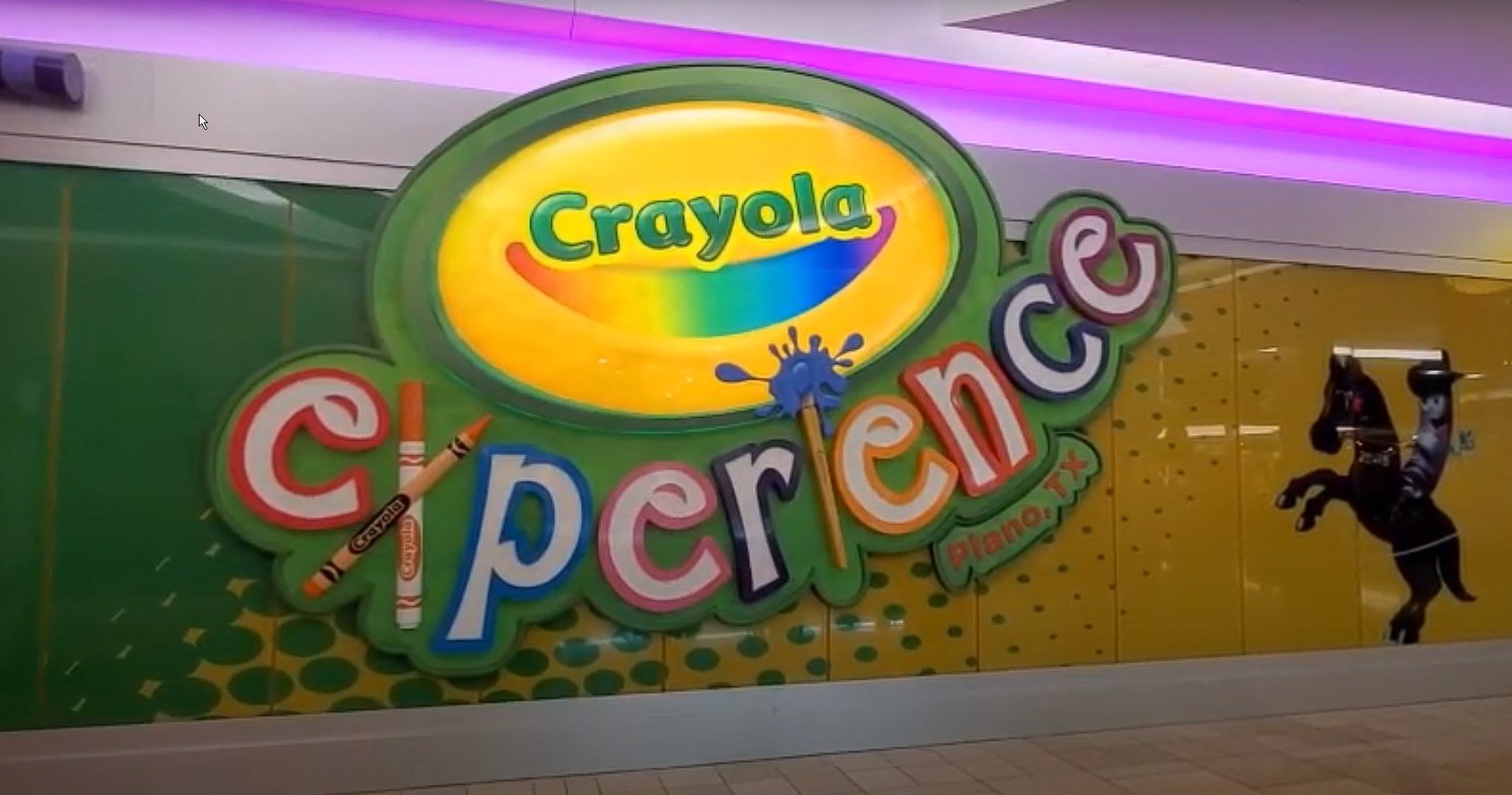 The Crayola Experience sign in Plano, TX, at The Shops at Willow Bend