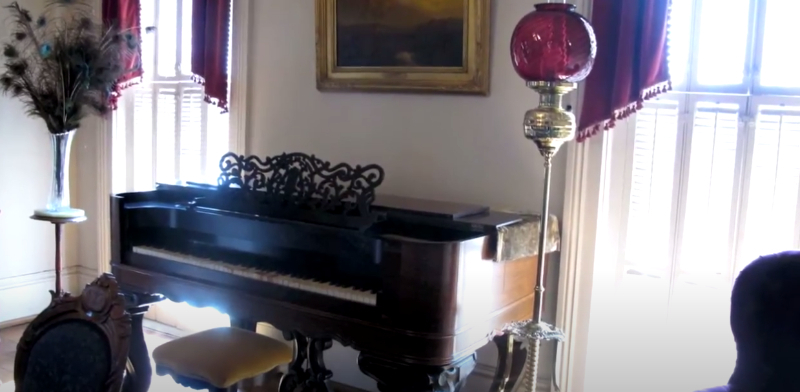 Historic Waco parlor with a piano
