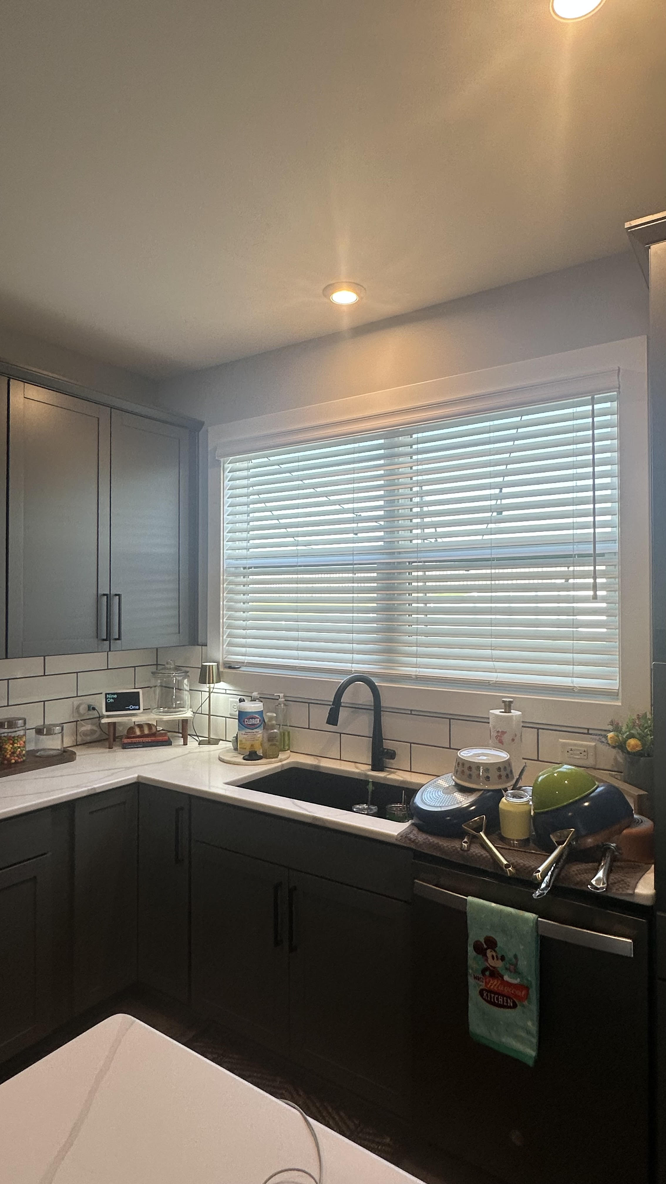 Faux wood blinds in a kitchen installed by Simmonds Blinds and Drapes in Owensboro, KY. Call (270) 477-3071 for durable window coverings.