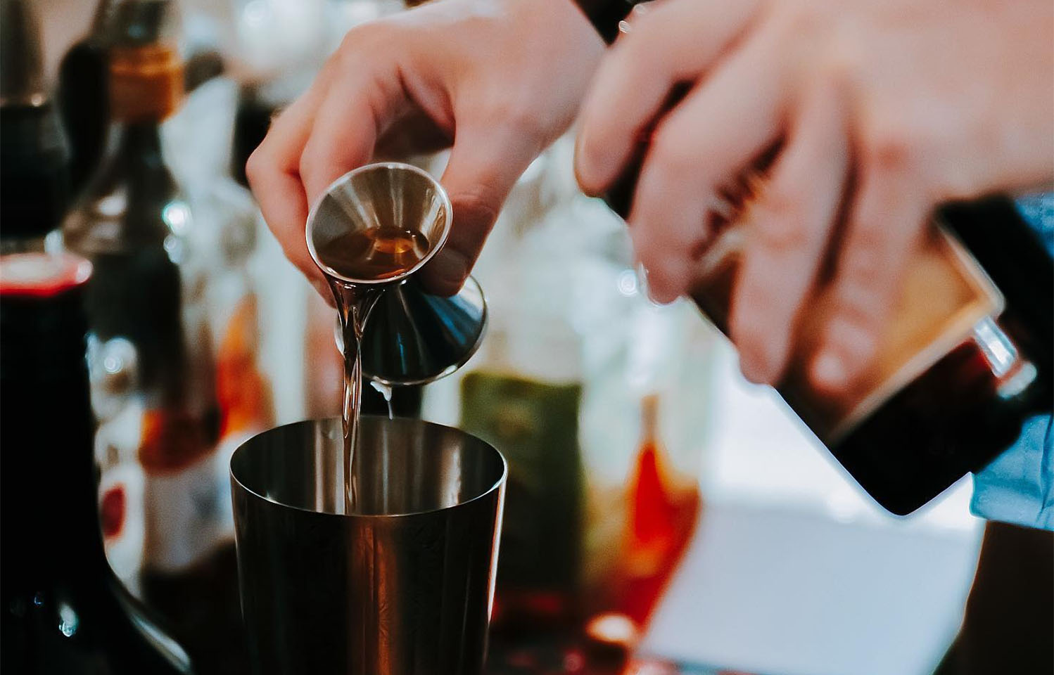 Enjoy speciality cocktails in this speakeasy bar at the Vault in Columbia, MO.