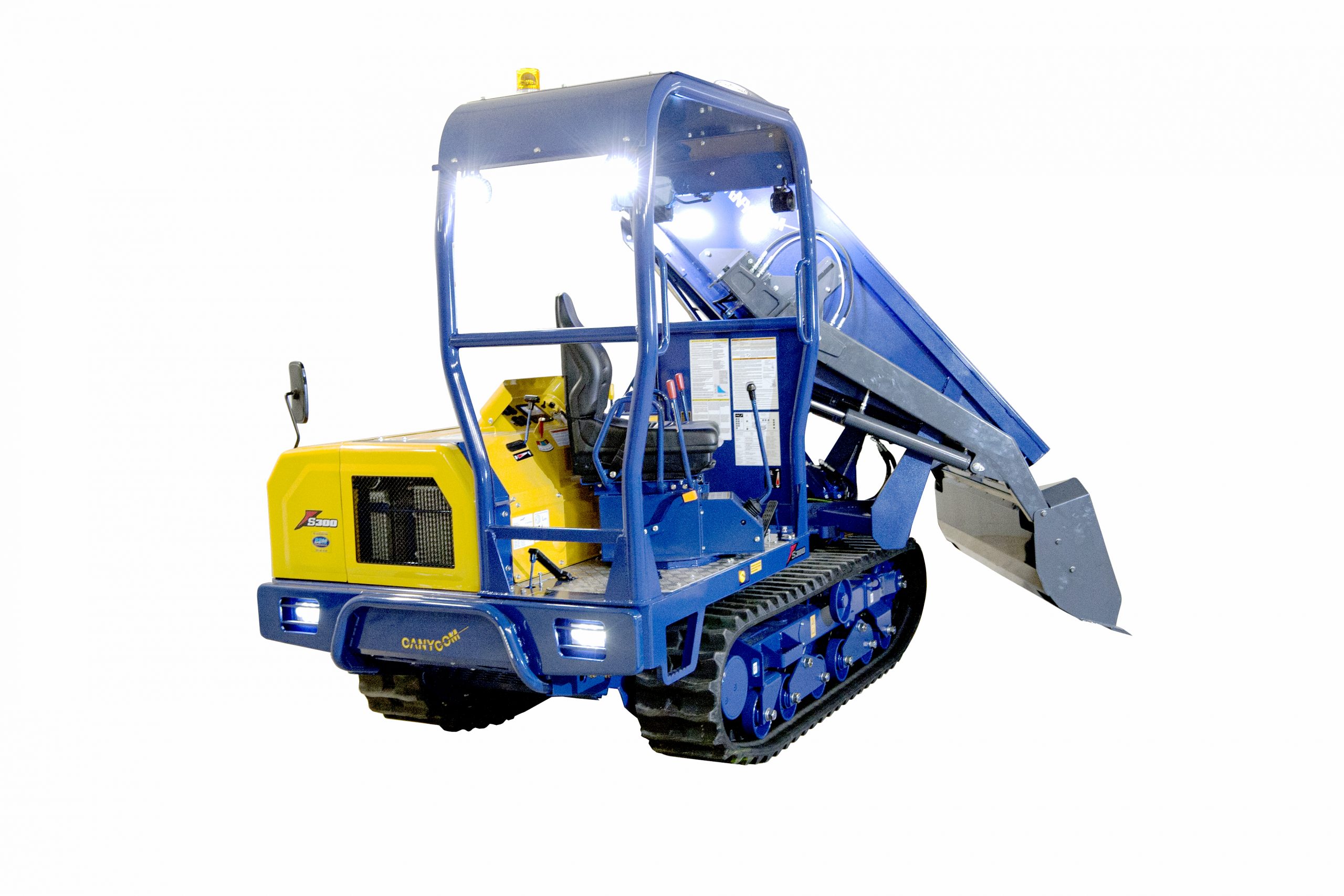 The Canycom S300PD Heavy-duty Carrier with 180&deg; Pivoting Dump Box is powered with a 47 HP Tier 4 Kubota Diesel engine and hauls up to 6,614 lbs. Suitable for grades up to 25&deg;. The Pivoting Dump Box and Rubber Track Undercarriage results in reduced ground impact and increased maneuverability.