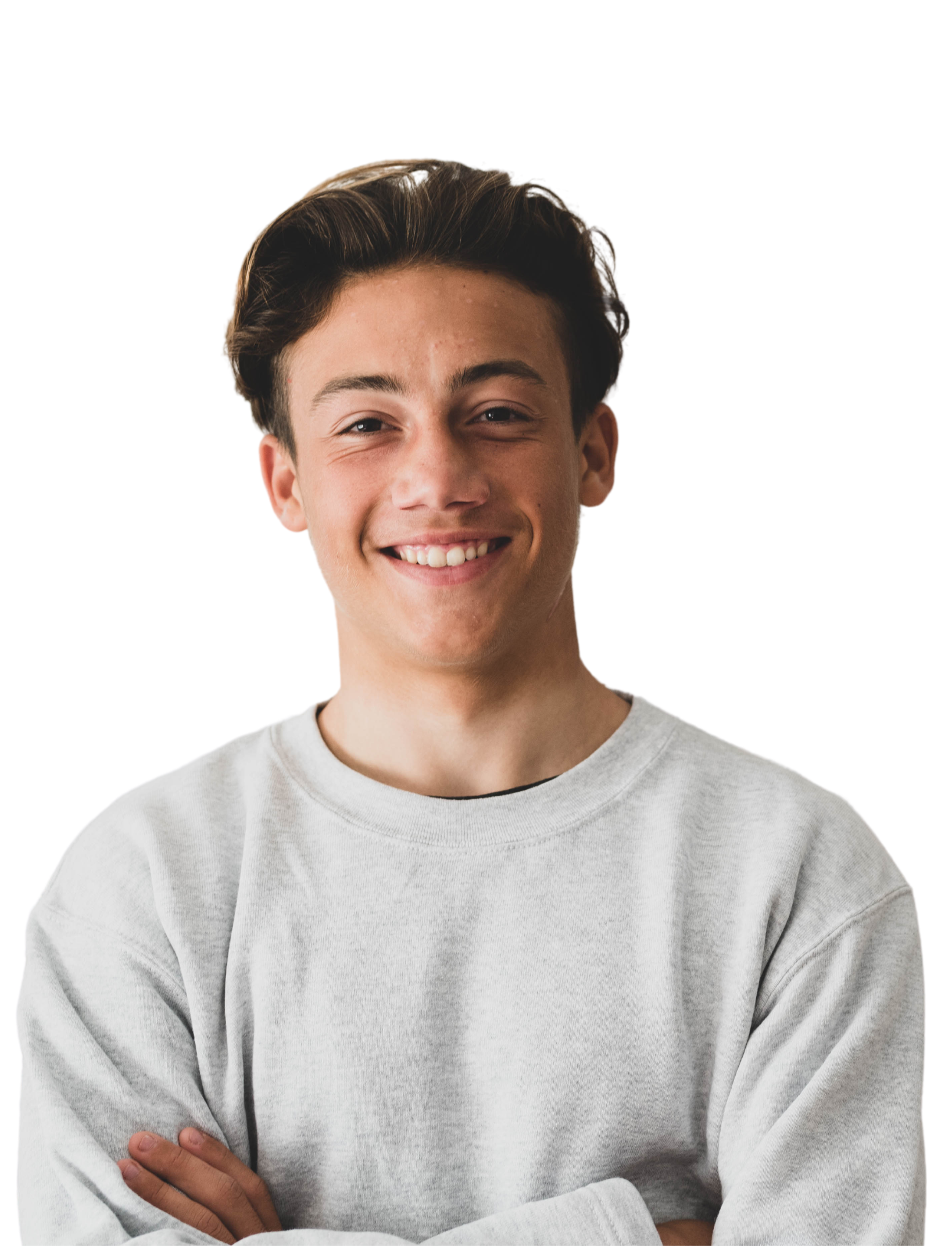 A woman in a white shirt is smiling with her hand on her chin