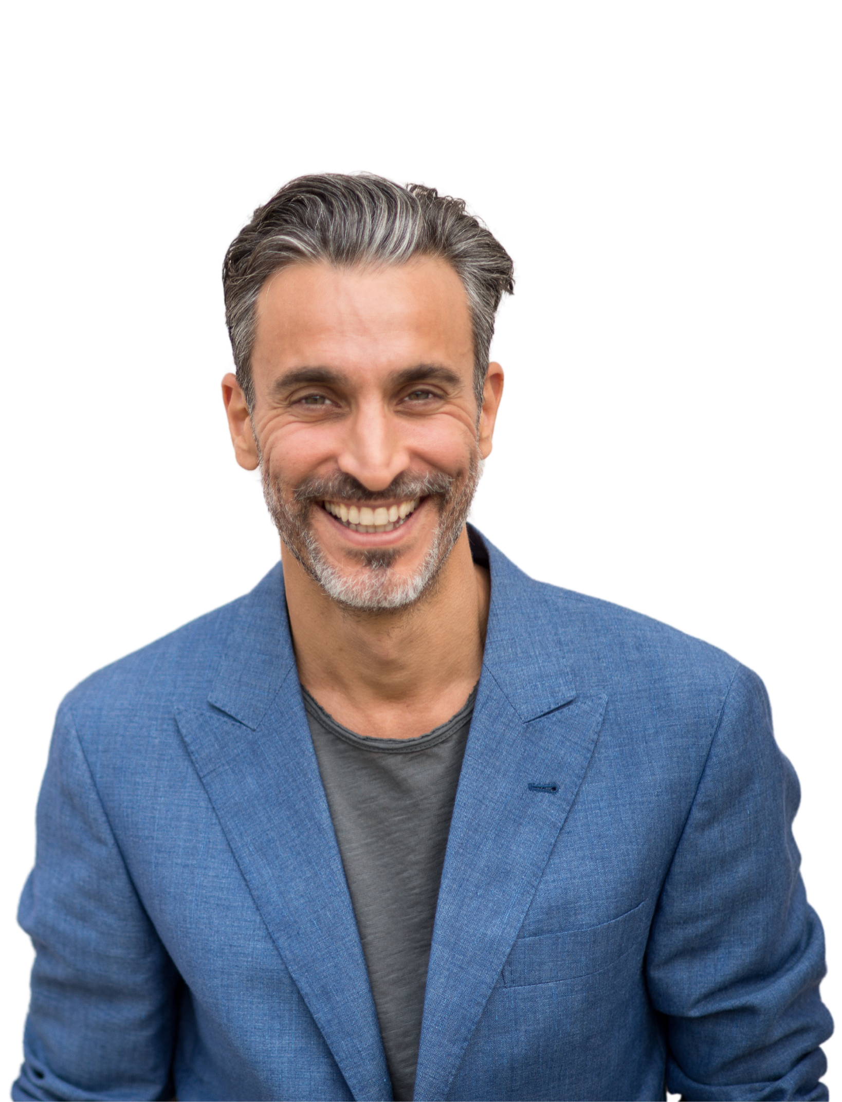 A woman in a white shirt is smiling with her hand on her chin