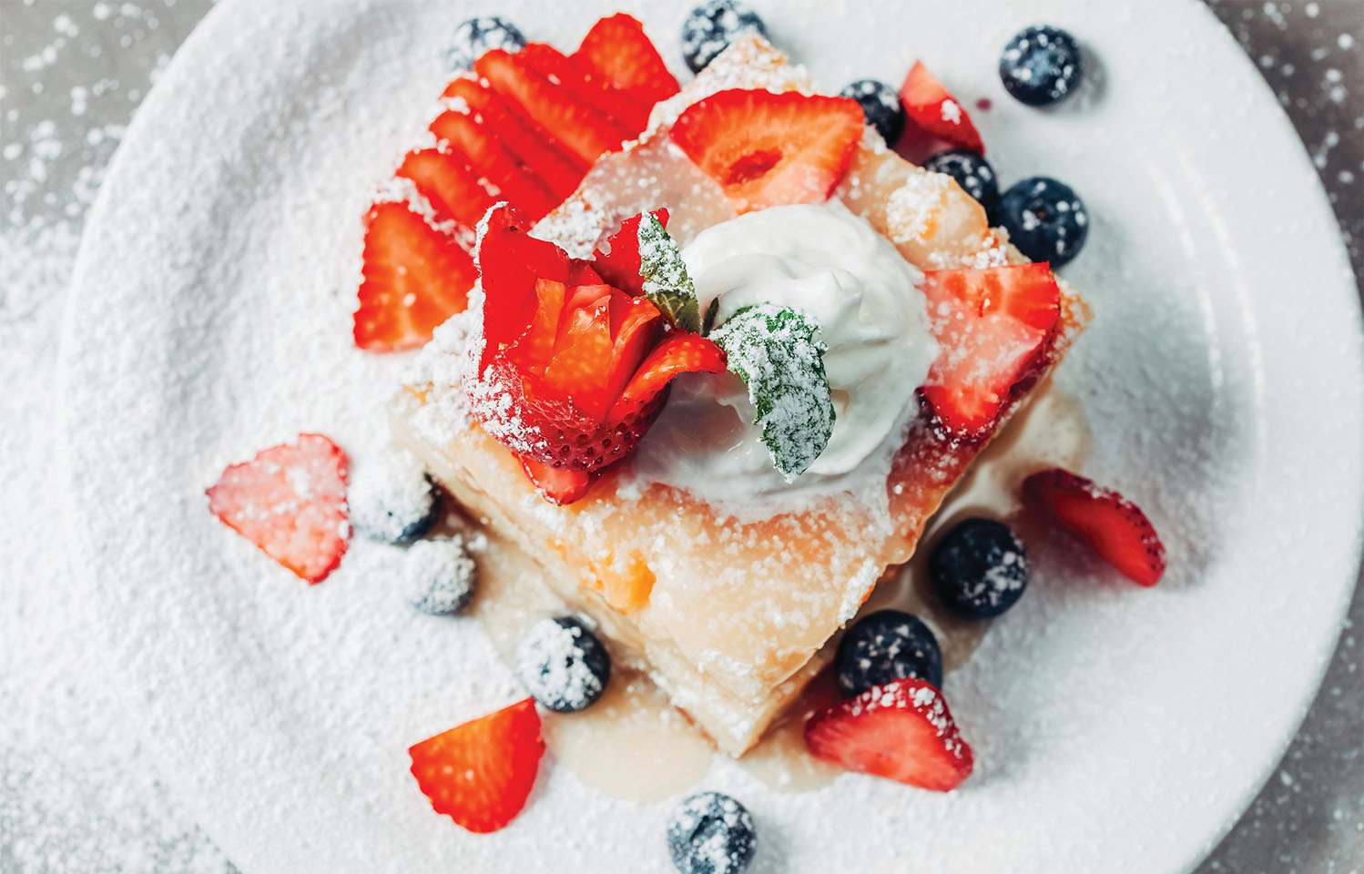 Sit inside our outside at Teller's Gallery & Bar to enjoy your lunch , dinner, or drinks in Columbia, MO.