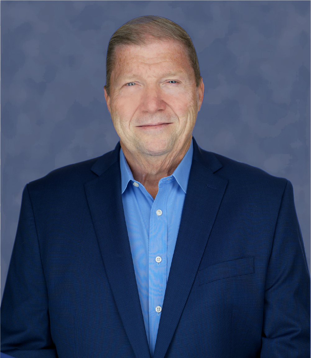 a woman wearing a black jacket and a red scarf is smiling for the camera .