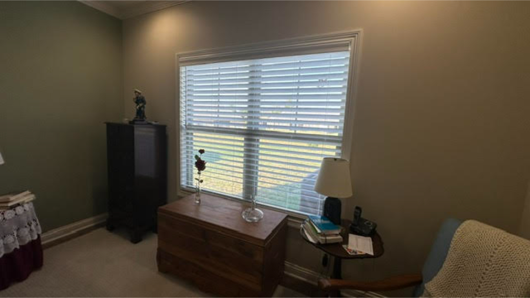 Custom faux wood blinds installed in a living room by Simmonds Blinds and Drapes in Alvaton, KY. Call (270) 550-1334 for window treatments.