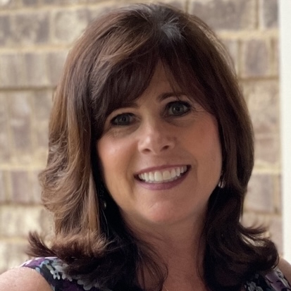 A woman is examining a man 's head in a lab